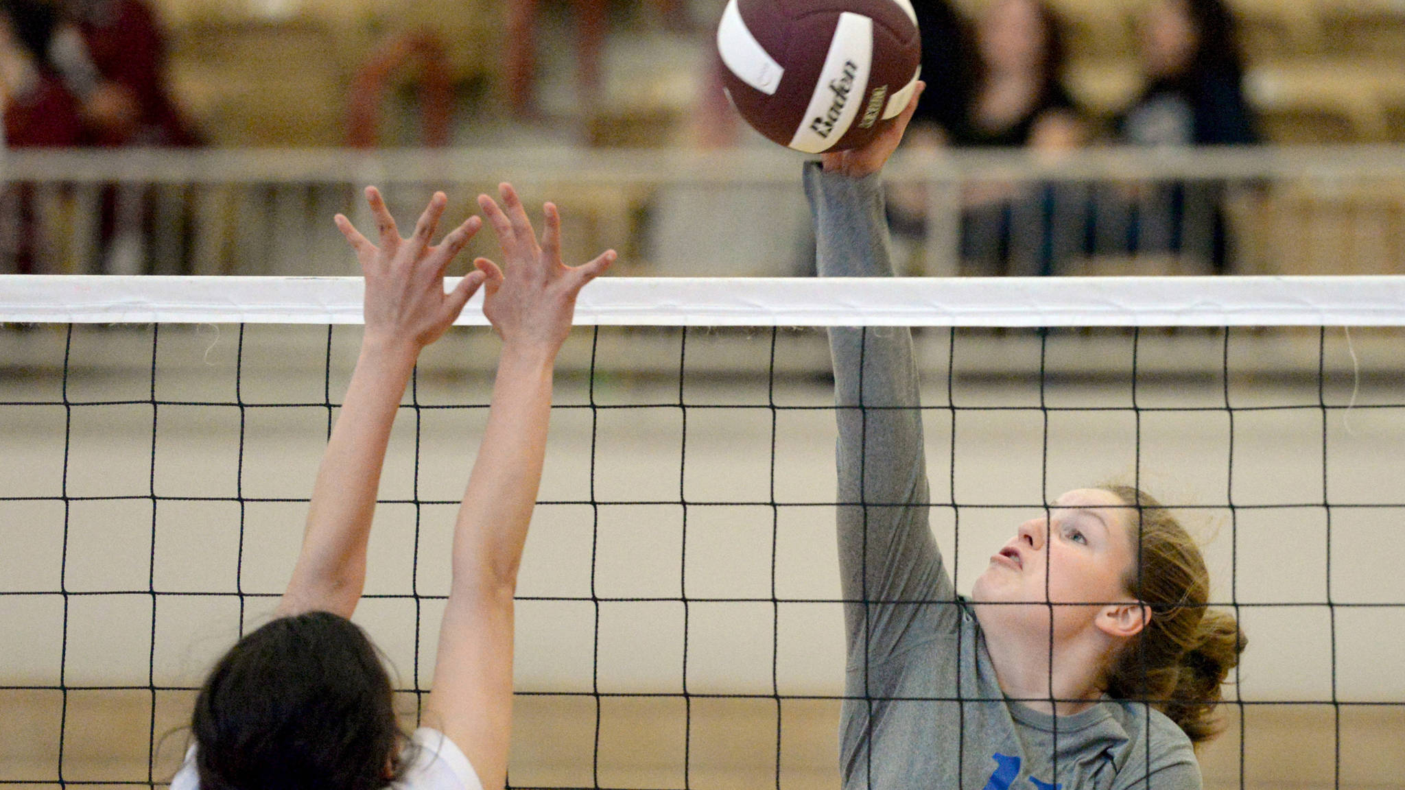 Thunder Mountain High School&rsquo;s Audrey Welling spikes the ball over the net earlier this season during a jamboree in Ketchikan. (Taylor Balkom | Ketchikan Daily News)