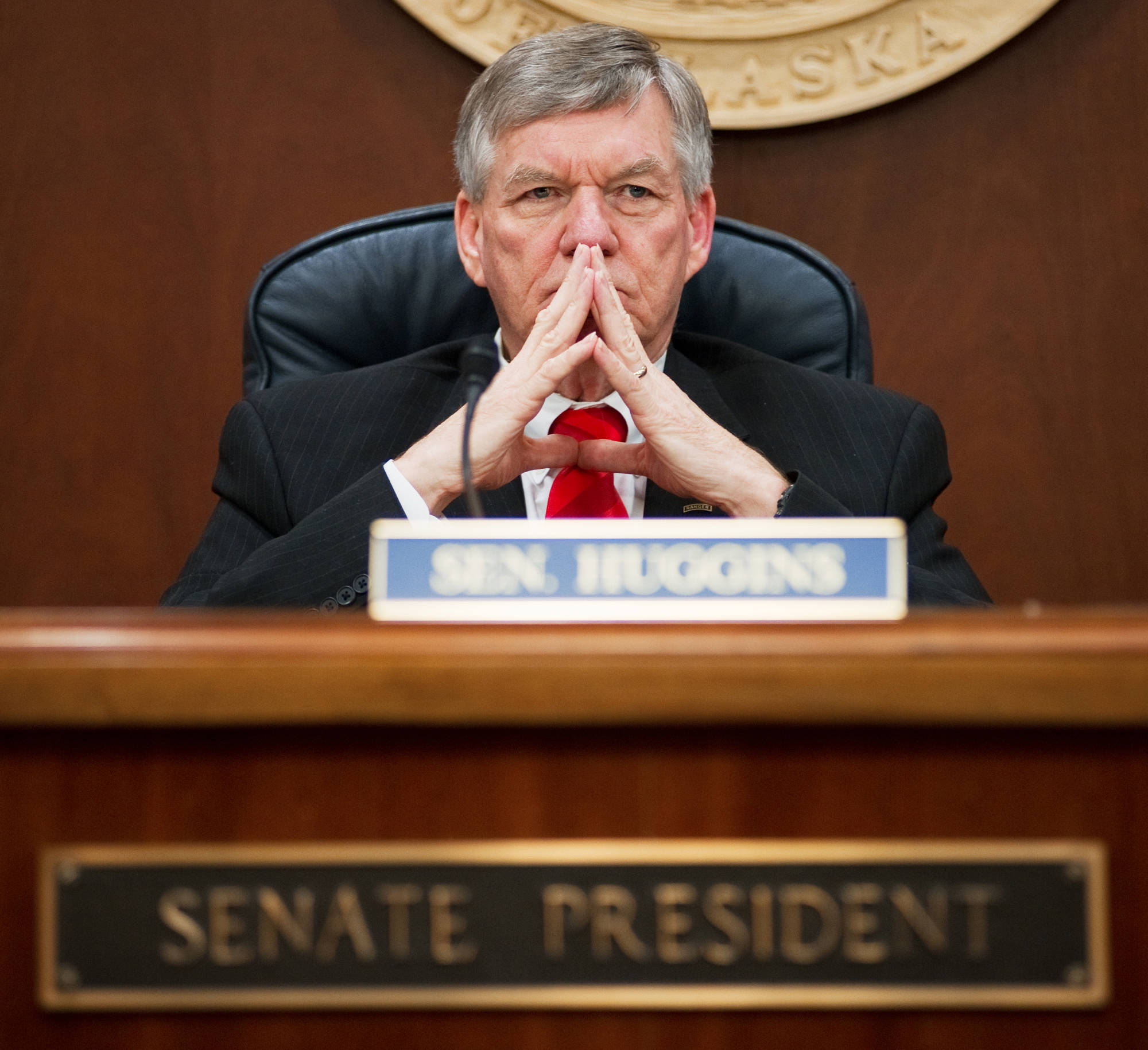 Senate President Charlie Huggins, R-Wasilla, waits for senators to arrive during a ‘call of the house’ as the Senate takes up the Alaska gasline development bill at the Capitol on Friday, April 12, 2013. Huggins has filed to run for governor. (Michael Penn | Juneau Empire File)
