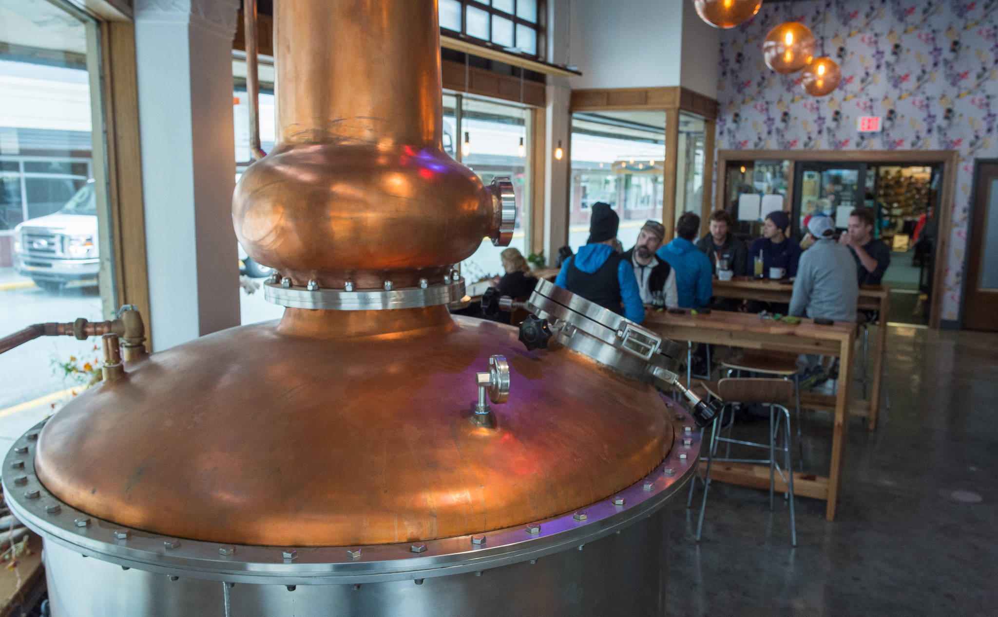 A large still is a centerpiece in the tasting room at the Amalga Distillery at Franklin and Second Streets on Thursday, Sept. 14, 2017. (Michael Penn | Juneau Empire)