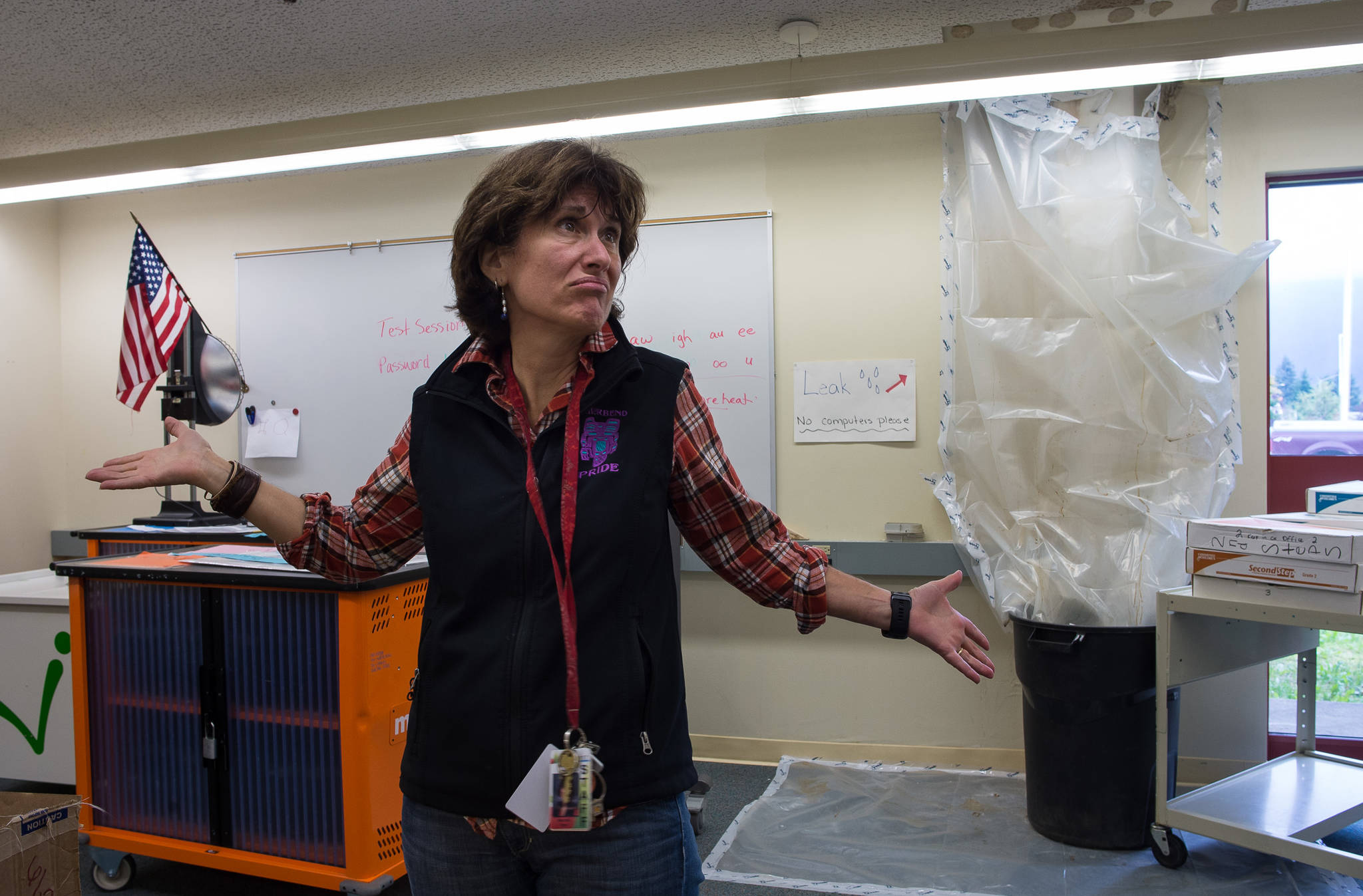 Principal Michelle Byer expresses her frustration with roof leaks at Riverbend Elementary School that drain into the school’s computer lab on Friday, Sept. 15, 2017. (Michael Penn | Juneau Empire)