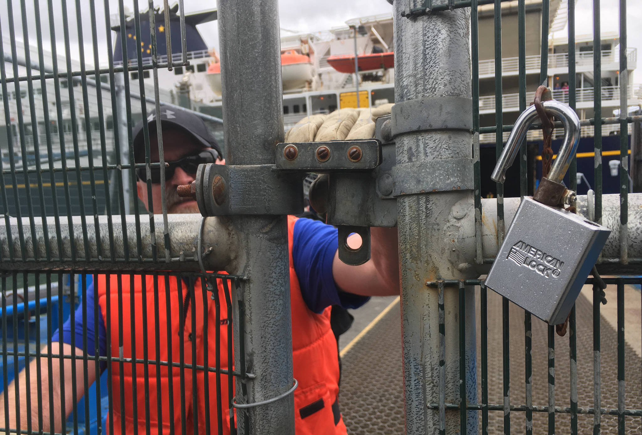 In this June 13 photo, an Alaska Marine Highway System terminal crewman closes the gate to board the ferry Kennicott as it leaves for Yakutat. (Michael Penn | Juneau Empire File)