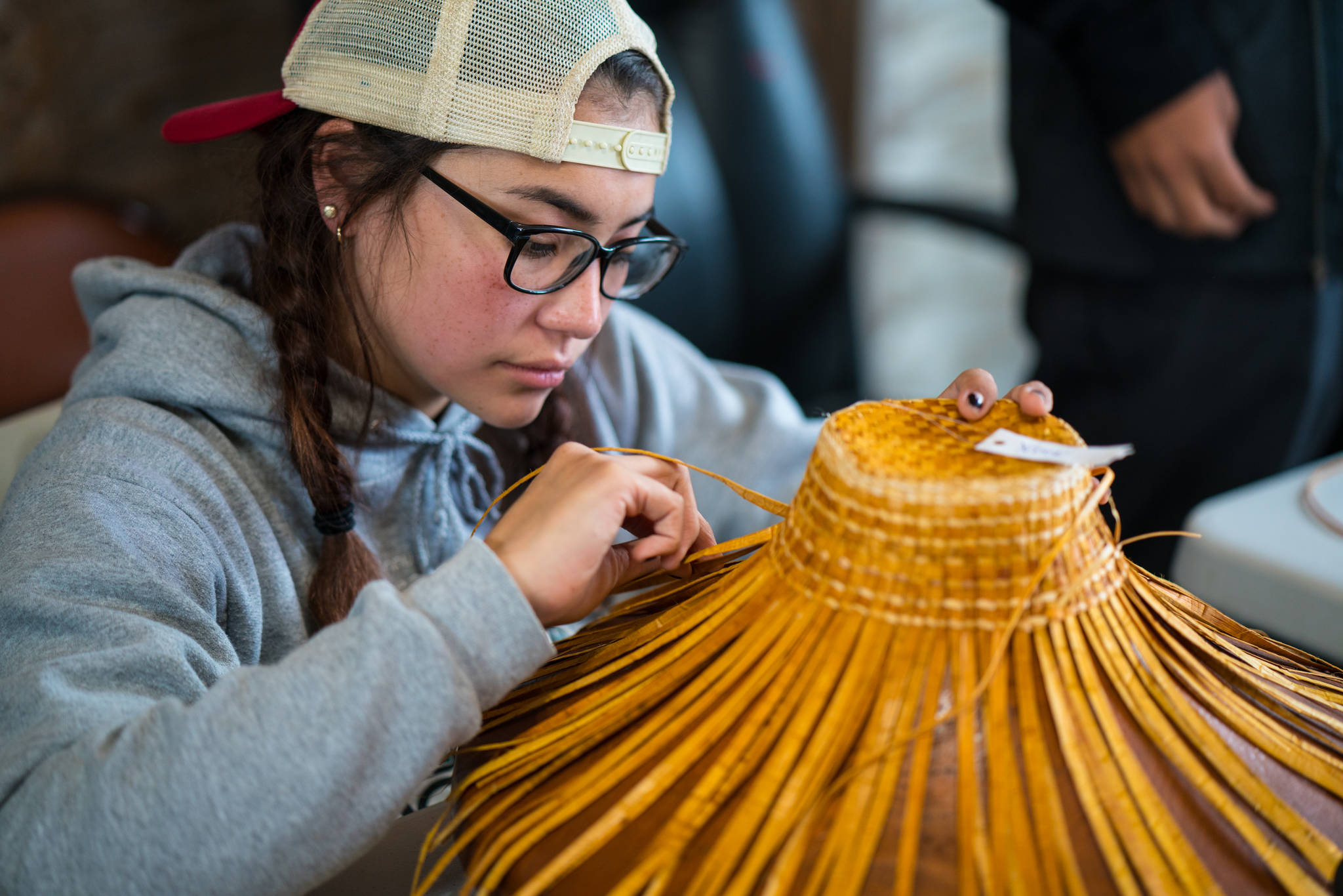 Participants learn new skills and weaving and leave with their own cedar hat. (Photo by Bethany Goodrich)