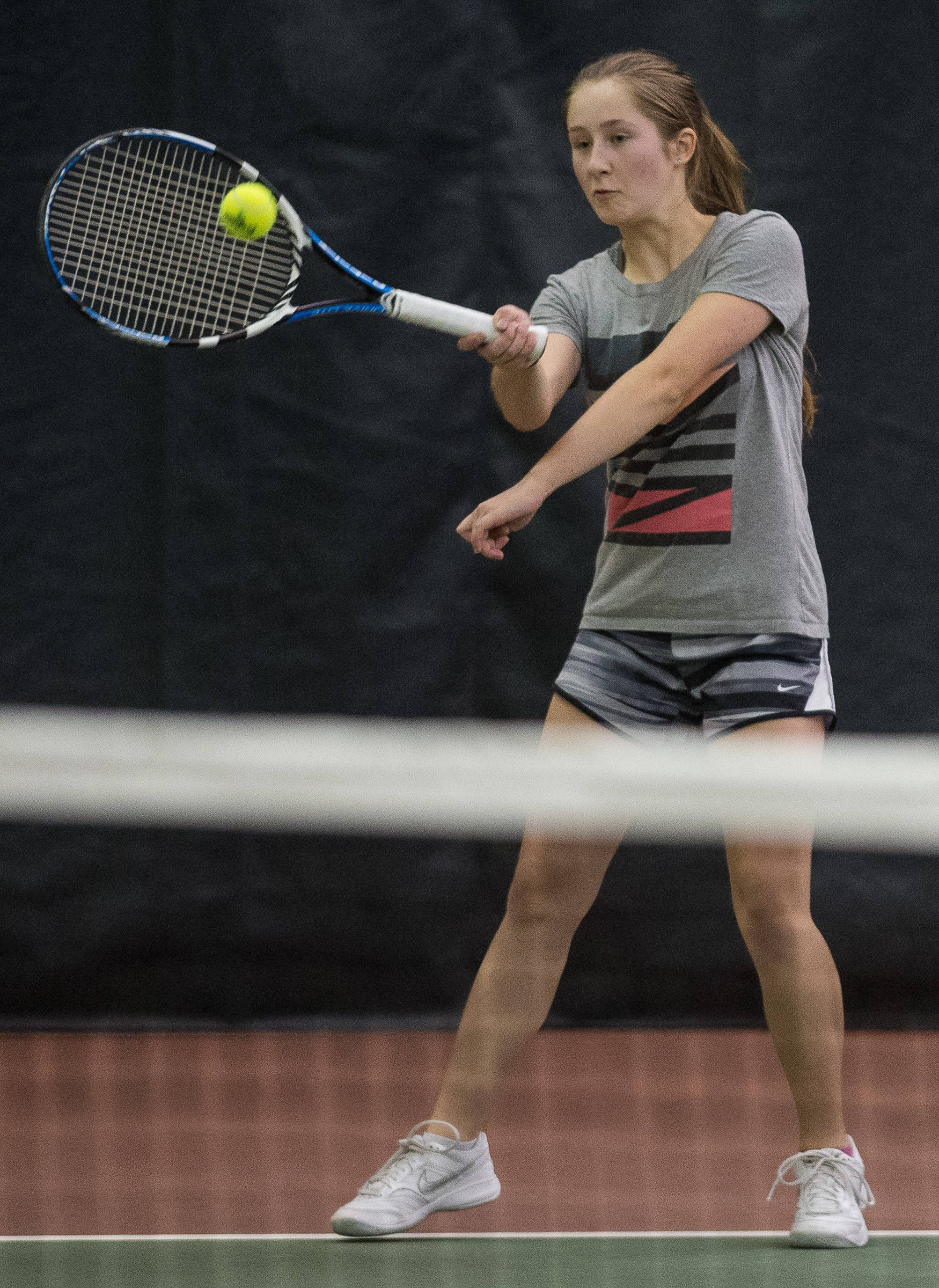 Adelie McMillian returns a serve during a mixed-doubles match with partner Sammy McKnight against the team of Madisyn Carter and Kolby Hoover in a Southeast Regional Tournament match at JRC/The Alaska Club on Thursday, Sept. 21, 2017. McKnight and McMillian won the match 8-4. (Michael Penn | Juneau Empire)