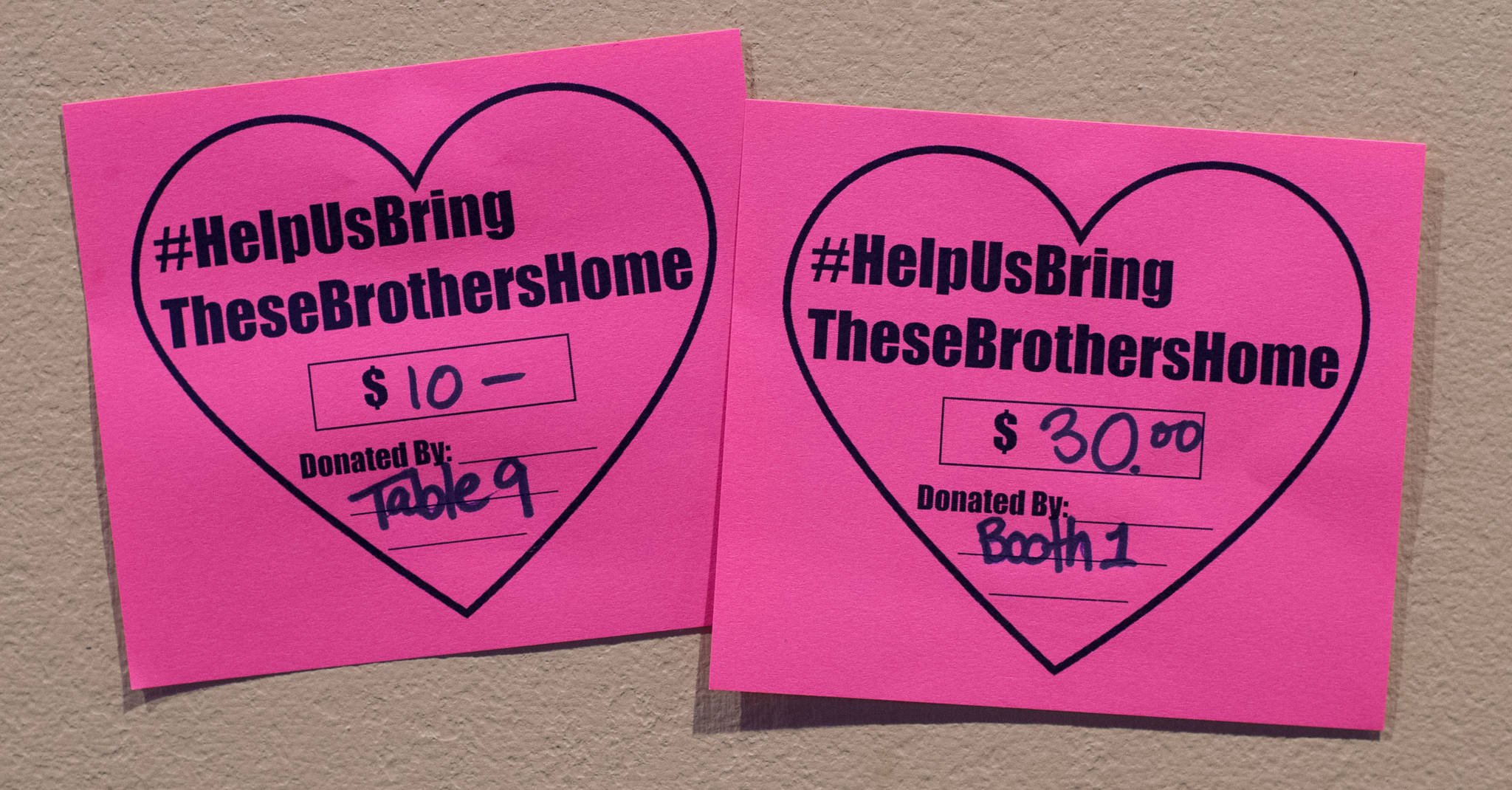 Cards displayed at McGivney&rsquo;s Sports Bar & Grill in the Mendenhall Valley on Tuesday, Sept. 26, 2017, show money given to a fundraising drive to sent the bodies of two brothers killed in a downtown fire last week back to their family in Mexico. (Michael Penn | Juneau Empire)