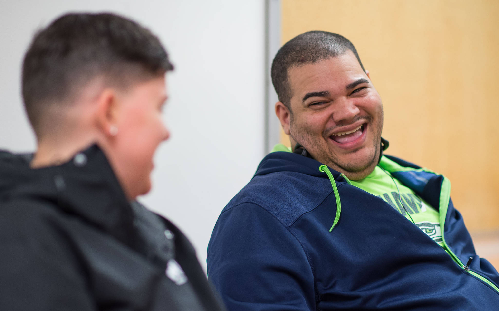 REACH client Niall Johnson, right, shares a laugh with Laurel Stafford, a employment specialist at REACH, on Friday, Sept. 29, 2017. Johnson currently works at Office Max in the Nugget Mall. October is National Disability Employment Awareness Month. (Michael Penn | Juneau Empire)