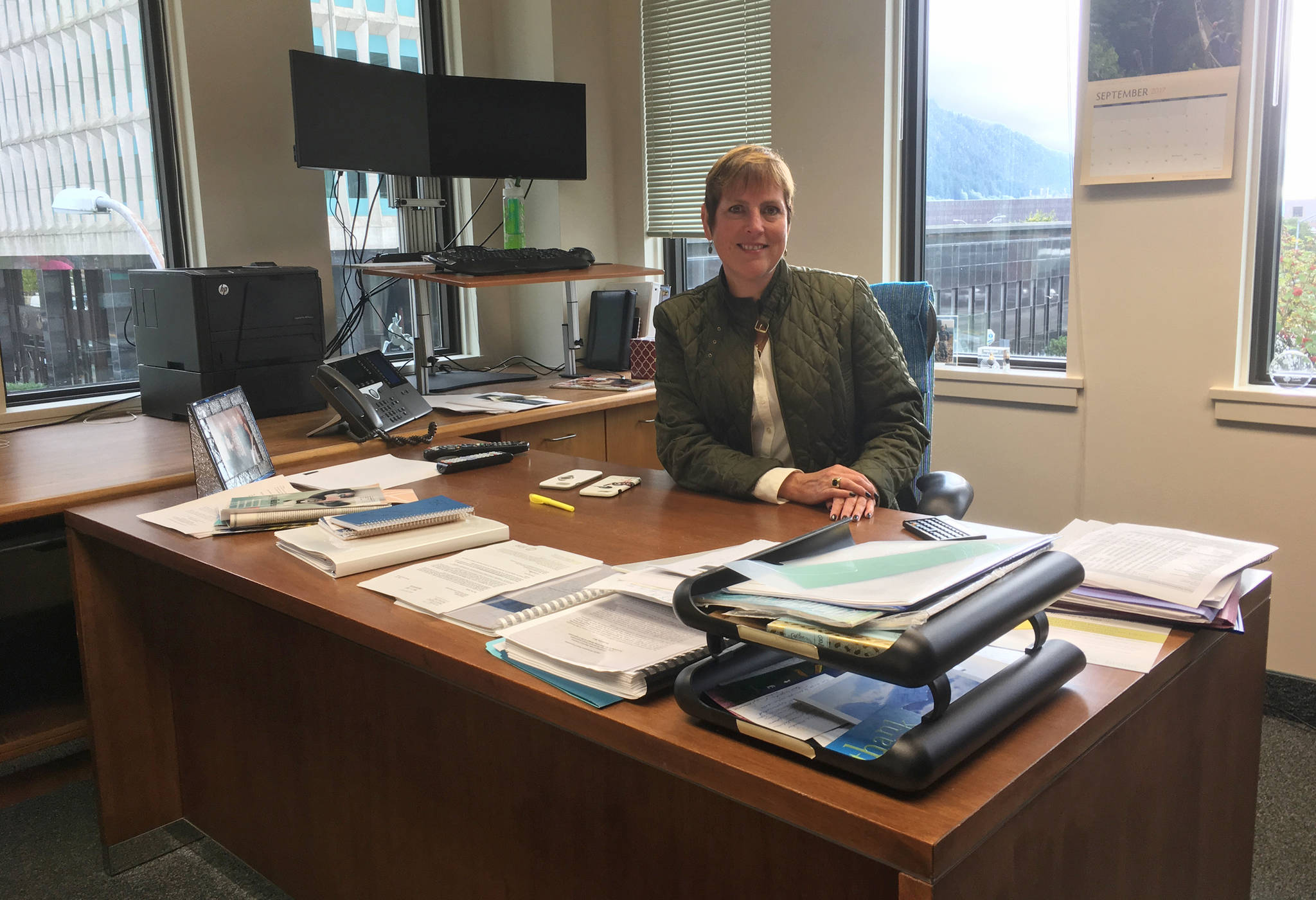 Alaska Permanent Fund Corporation director Angela Rodell is seen at her desk in the Permanent Fund headquarters building on Sept. 29, 2017. (James Brooks | Juneau Empire)