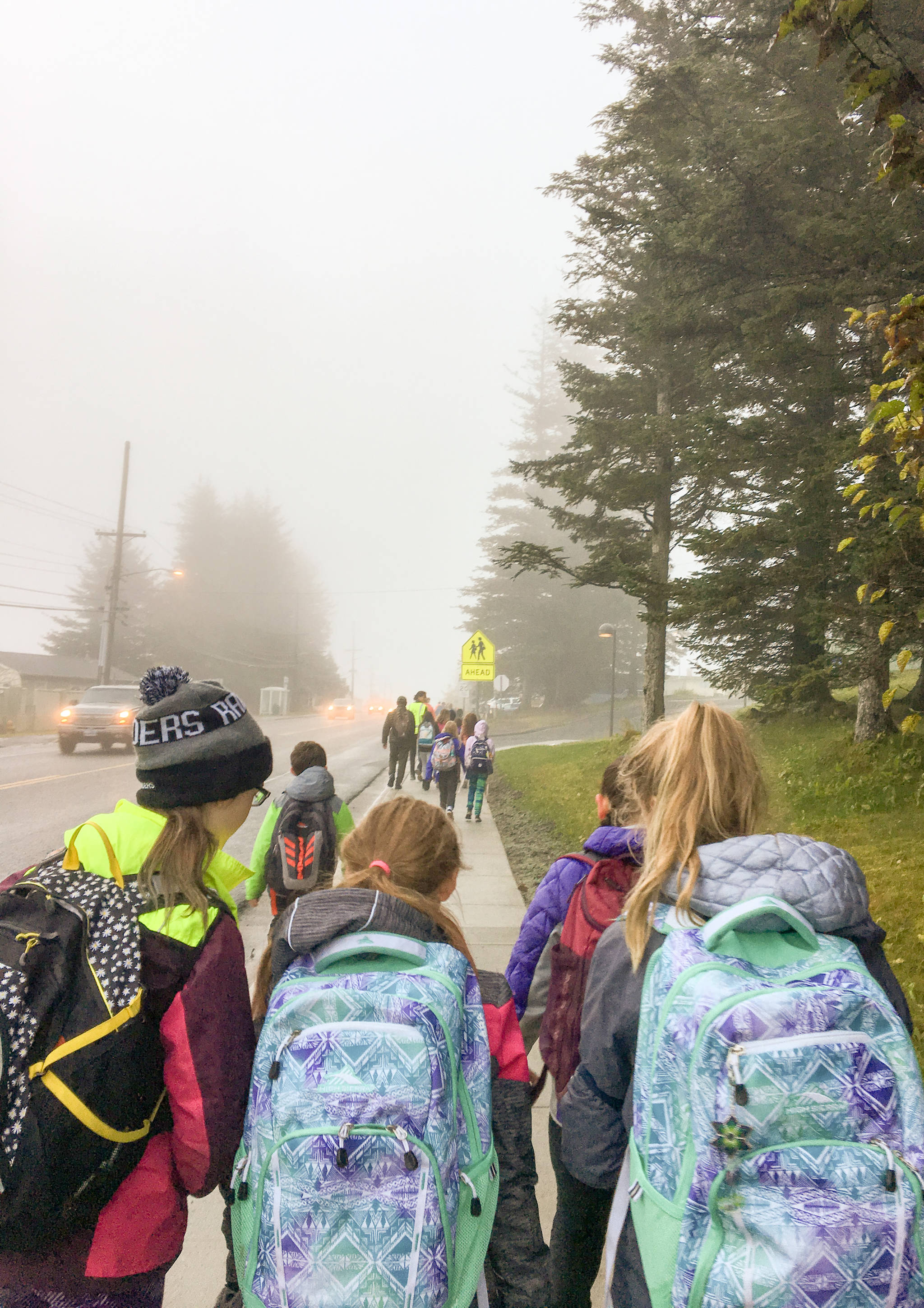 Students walk to the Gastineau School on Wednesday, Oct. 4 to celebrate International Walk to School Day. The day is meant to celebrate safe pedestrian schools and remind drivers to be aware of those walking to school. (Photo courtesy of Marcheta Moulton)
