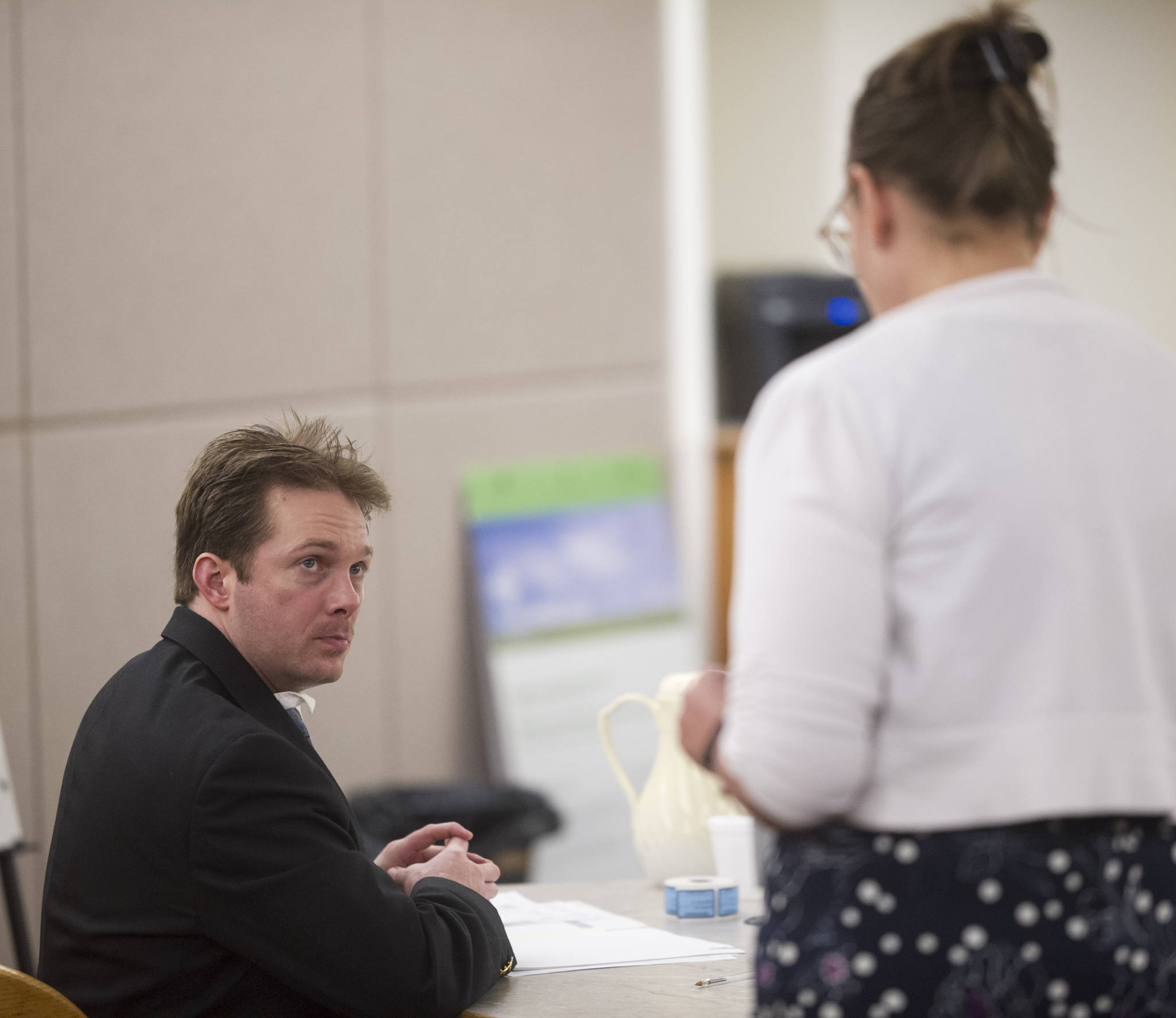 Christopher Strawn speaks with Juneau Assistant District Attorney Amy Paige at the start of his trial in Juneau Superior Court on Thursday, Oct. 5, 2017. Strawn, 34, faces charges of first-degree and second-degree murder, manslaughter, criminally negligent homicide, third-degree assault and weapons misconduct in the shooting death of Brandon Cook in October 2015. (Michael Penn | Juneau Empire)
