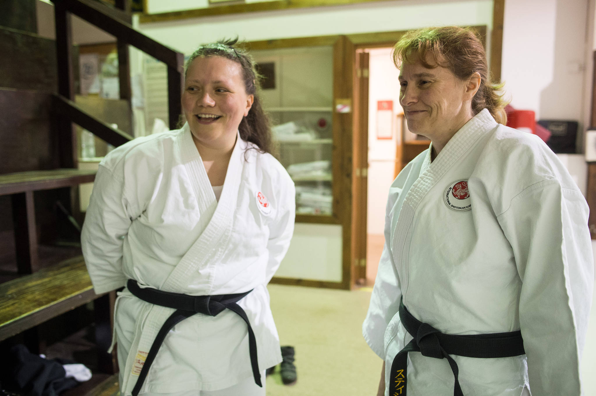 Maraiya Gentili, left, and Stacey Poulson at Juneau Shotokan Karate on Thursday, Oct. 5, 2017. Gentili was recently awarded her second degree black belt. Poulson was recently awarded her third degree black belt. (Michael Penn | Juneau Empire)