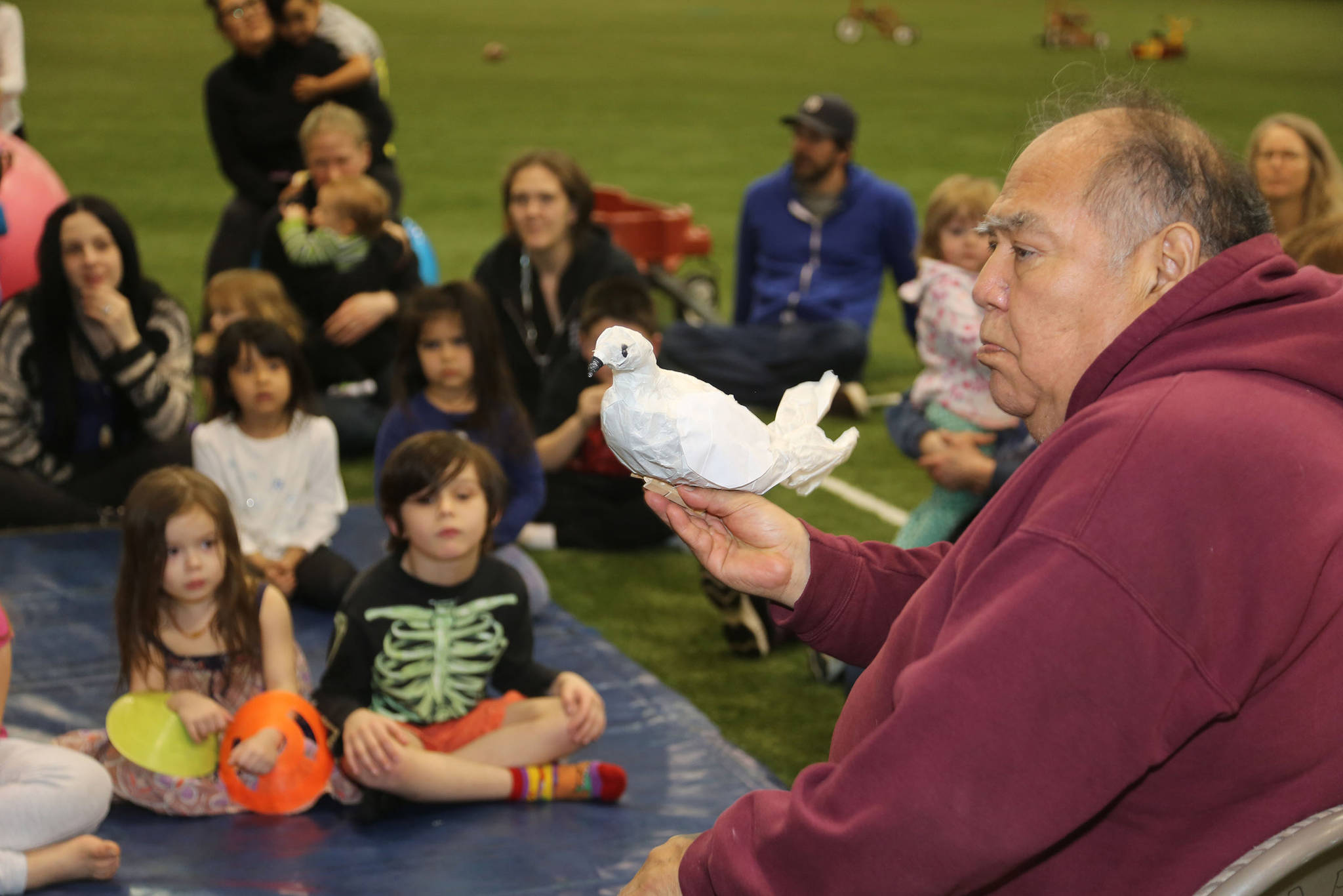 Elder David Katzeek speaks to children at a monthly Baby Raven Reads family event. Photo by Brian Wallace. Courtesy of SHI.