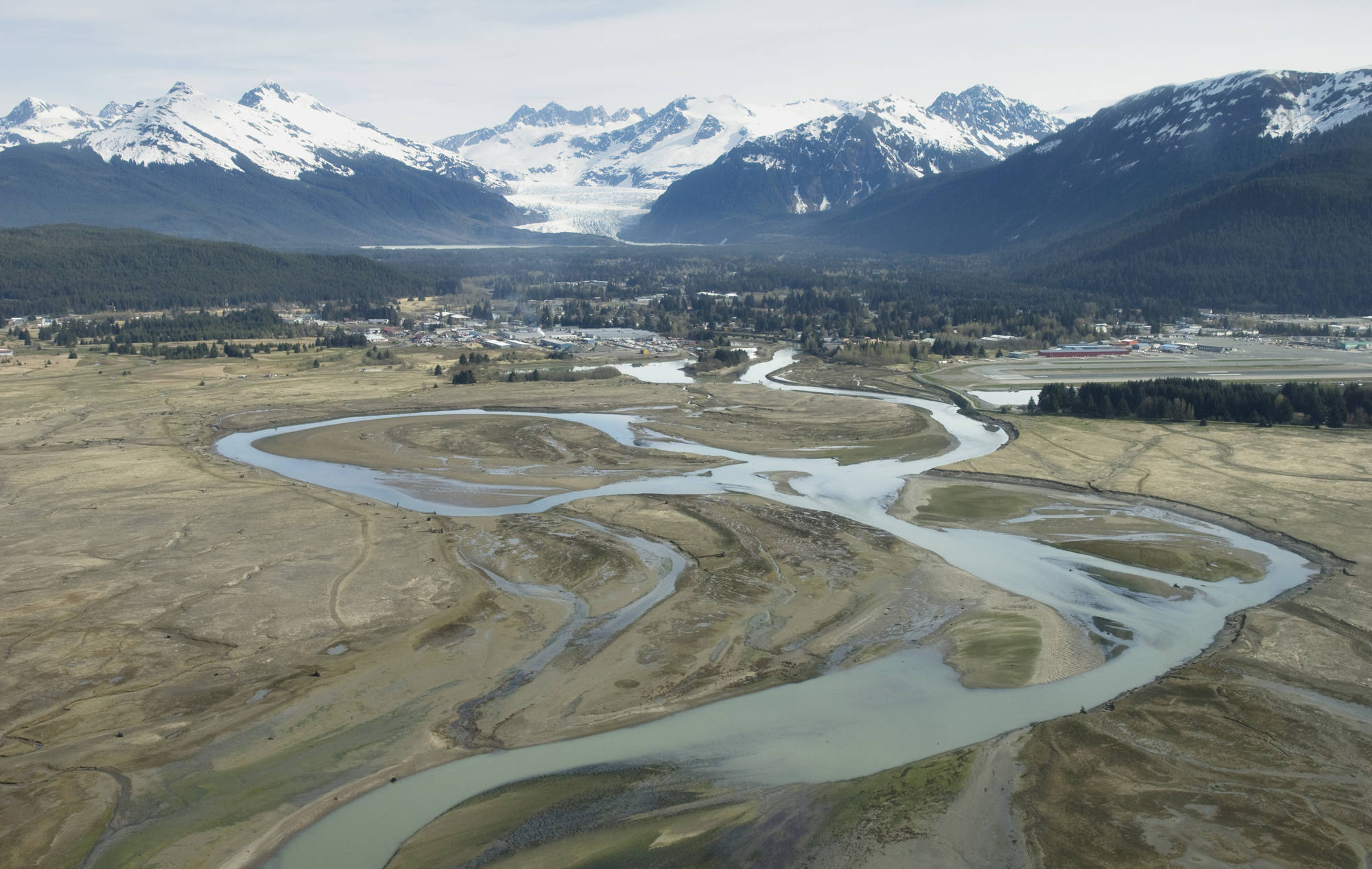In this May 2009 photo, the Mendenhall River flows out of the Mendenhall Valley past the northwestern tip of the Juneau International Airport and through the Mendenhall Wetlands State Game Refuge. (Michael Penn | Juneau Empire File)