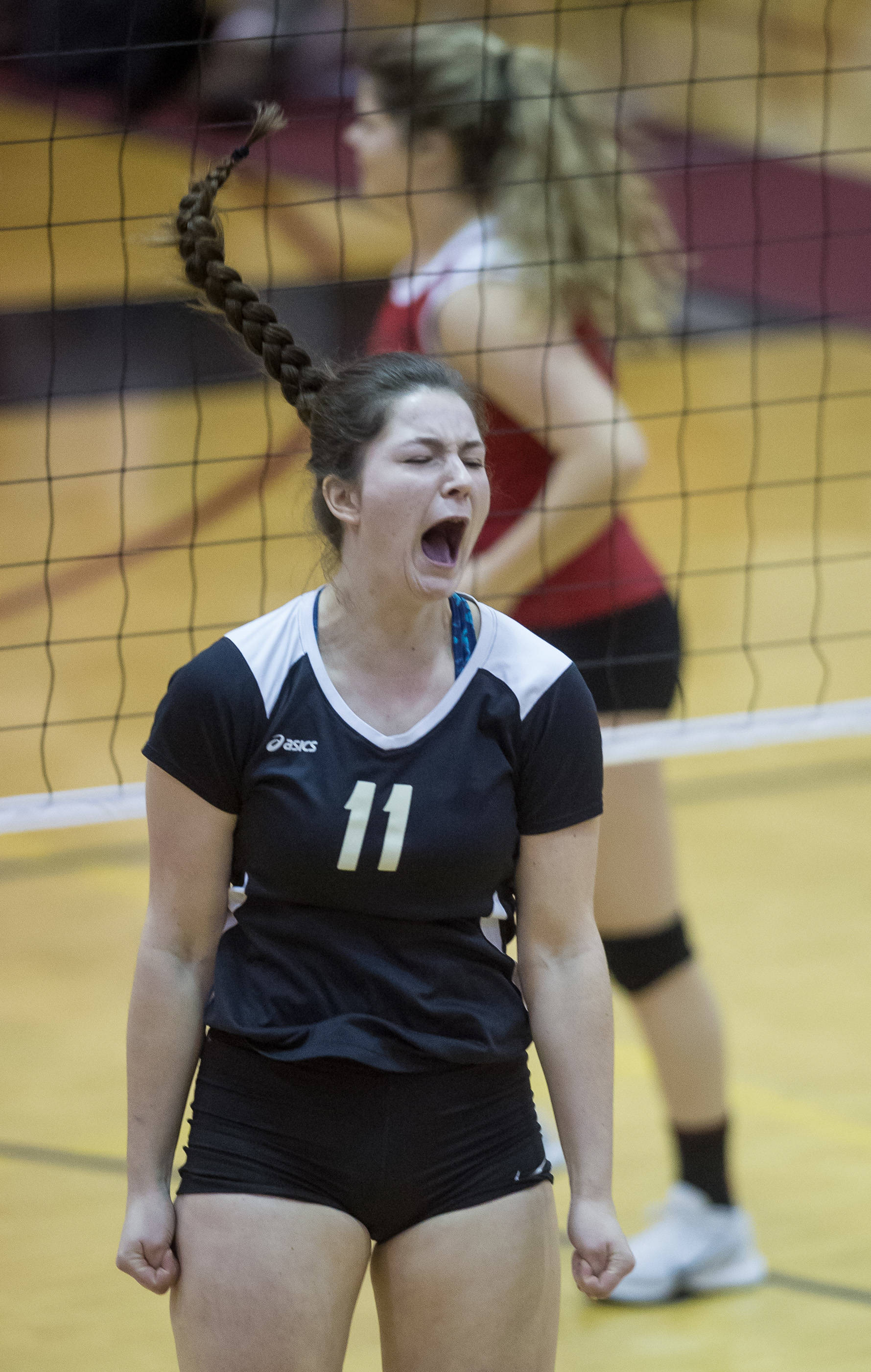 Petersburg’s Eliza Larson celebrates a point against Juneau-Douglas at the Juneau Invitational Volleyball Extravaganza at JDHS on Friday, Oct. 13, 2017.