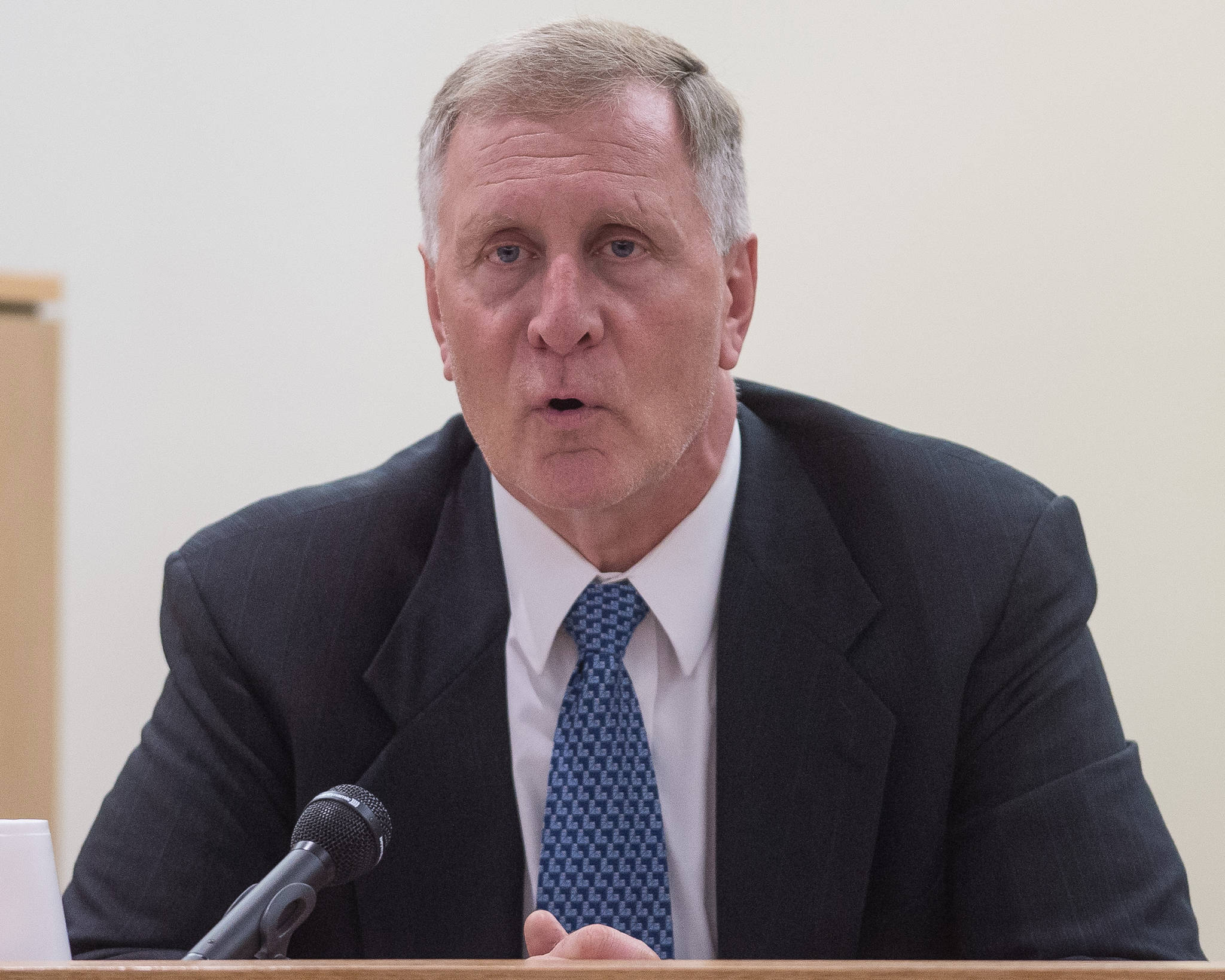 Robert J. Shem, a retired firearms examiner for the state of Alaska crime lab, speaks from the witness chair during the Christopher Strawn’s trial in Juneau Superior Court on Friday, Oct. 13, 2017. Strawn, 34, faces charges of first-degree and second-degree murder, manslaughter, criminally negligent homicide, third-degree assault and weapons misconduct in the shooting death of Brandon Cook in October 2015. (Michael Penn | Juneau Empire)
