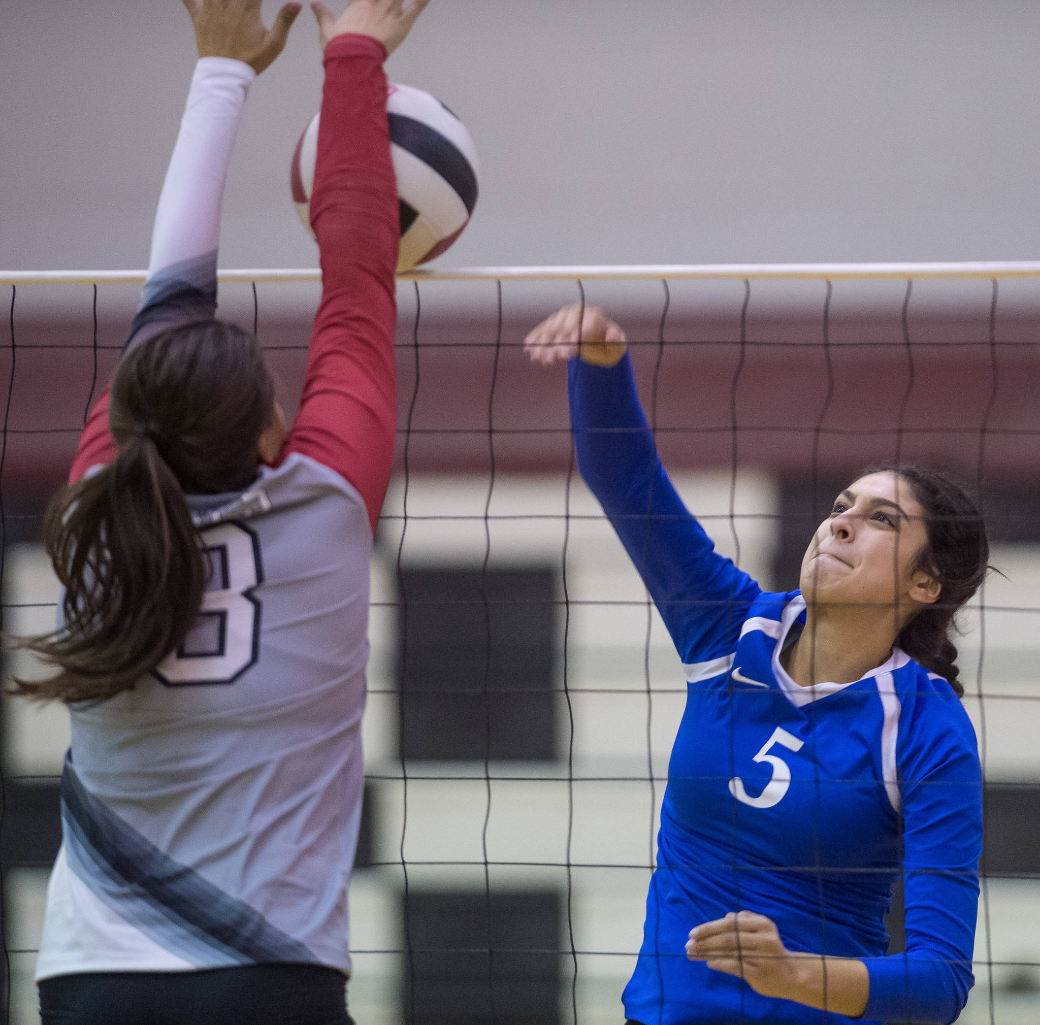 Thunder Mountain’s Maxie Saceda-Hurt, right, has her spike blocked by Wrangell’s Anna Allen at the Juneau Invitational Volleyball Extravaganza at JDHS on Friday, Oct. 13, 2017. (Michael Penn | Juneau Empire)