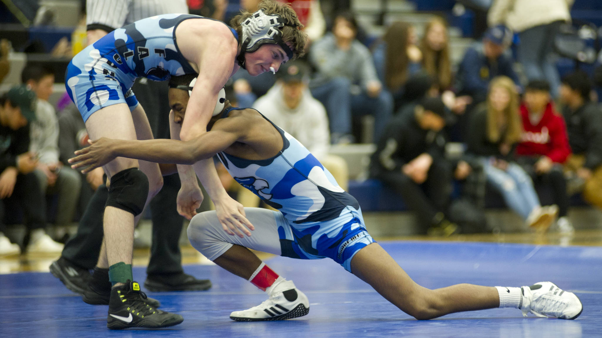 Thunder Mountain High School&rsquo;s Connor Norman, left, wrestles against teammate Jahrease Mays in the 113-pound bracket finals during the Brandon Pilot Invitational, Saturday, Oct. 21, 2017. Mays won in a 6-4 tiebreaker. (Nolin Ainsworth | Juneau Empire)