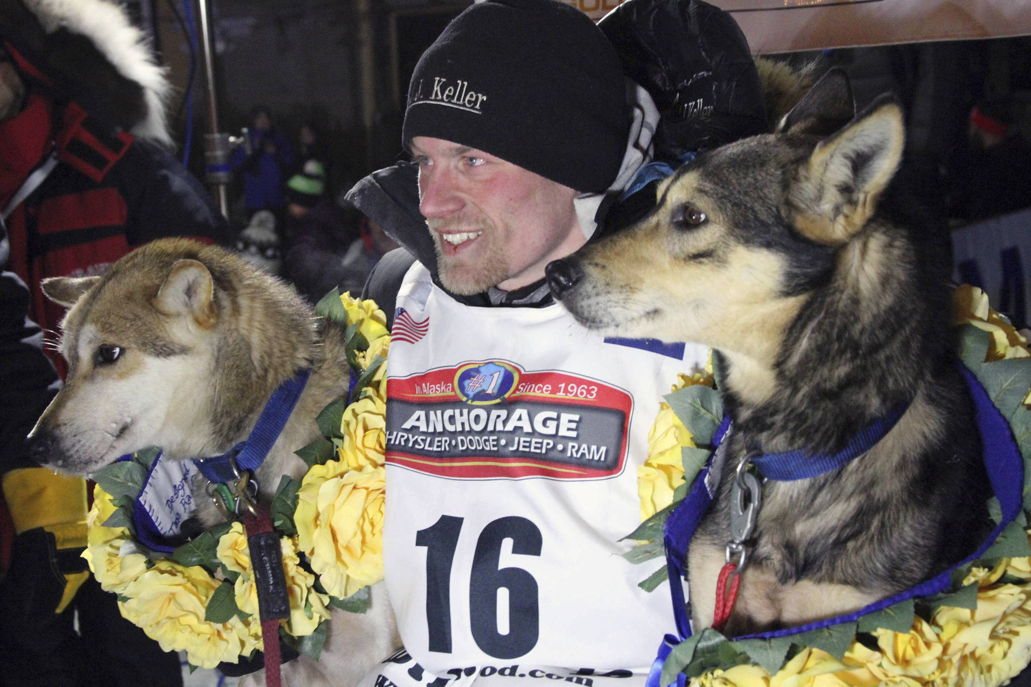 In this March 15, 2016 photo, Dallas Seavey poses with his lead dogs Reef, left, and Tide after finishing the Iditarod Trail Sled Dog Race in Nome. Seavey won his third straight Iditarod, for his fourth overall title in the last five years. Four-time Iditarod champion Dallas Seavey denies he administered banned drugs to his dogs in this year’s race, and has withdrawn from the 2018 race in protest. The Iditarod Trail Committee on Monday identified Seavey as the musher who had four dogs test positive for a banned opioid pain reliever after finishing the race last March in Nome. (Mark Thiessen | The Associated Press File)