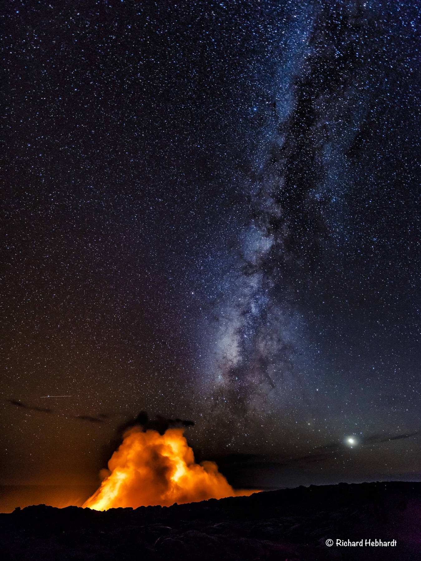A lava plume and the Milky Way as seen in Volcanoes National Park, Hawaii. (Photo by Richard Hebhardt)
