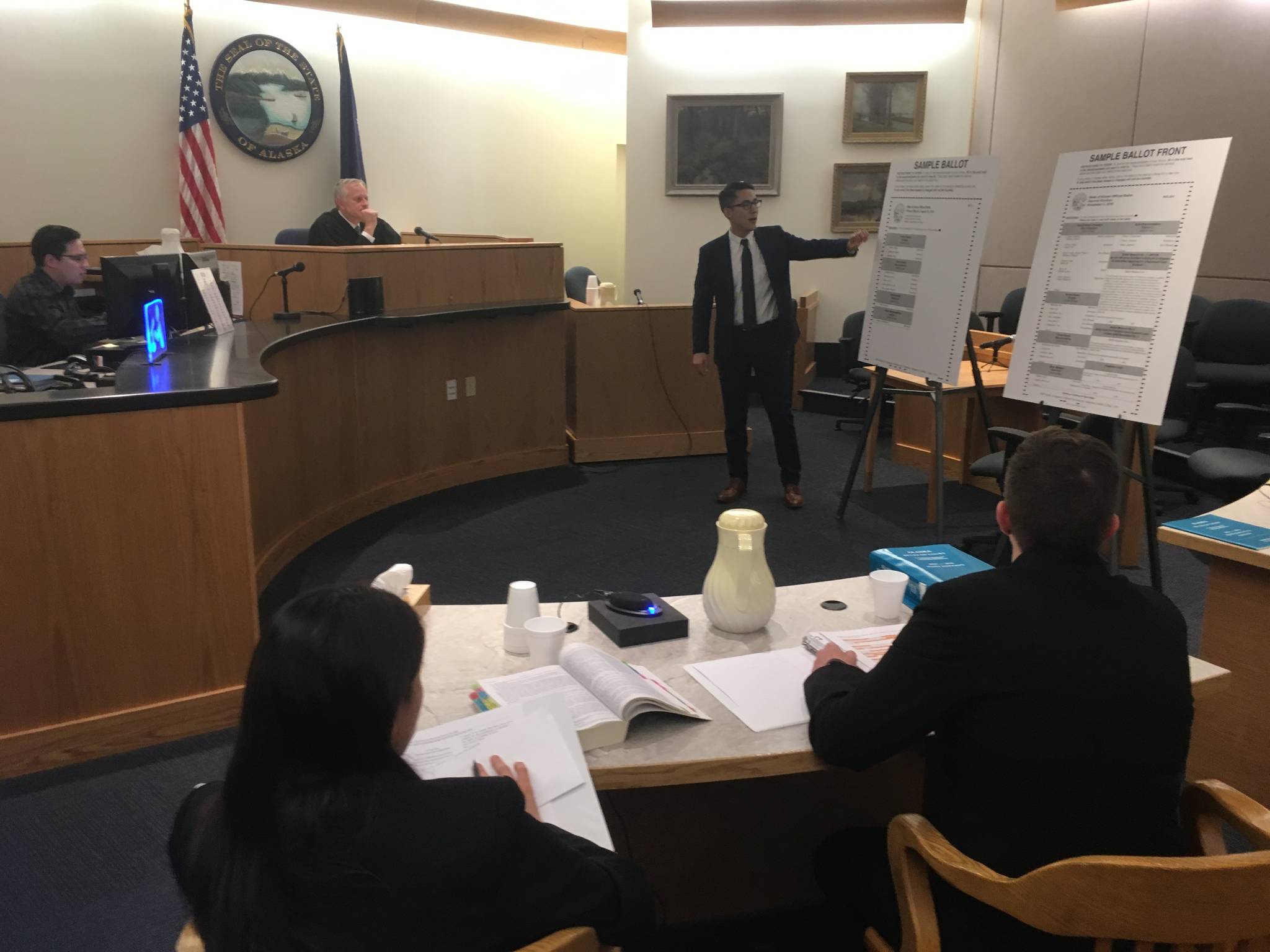 State attorneys Elizabeth Bakalar, foreground left, and Margaret Paton-Walsh, foreground right, listen to arguments made by attorney Jon Choate on Thursday, Sept. 21, 2017 in Alaska Superior Court in Juneau. At background left is Judge Philip Pallenberg. (James Brooks | Juneau Empire file)