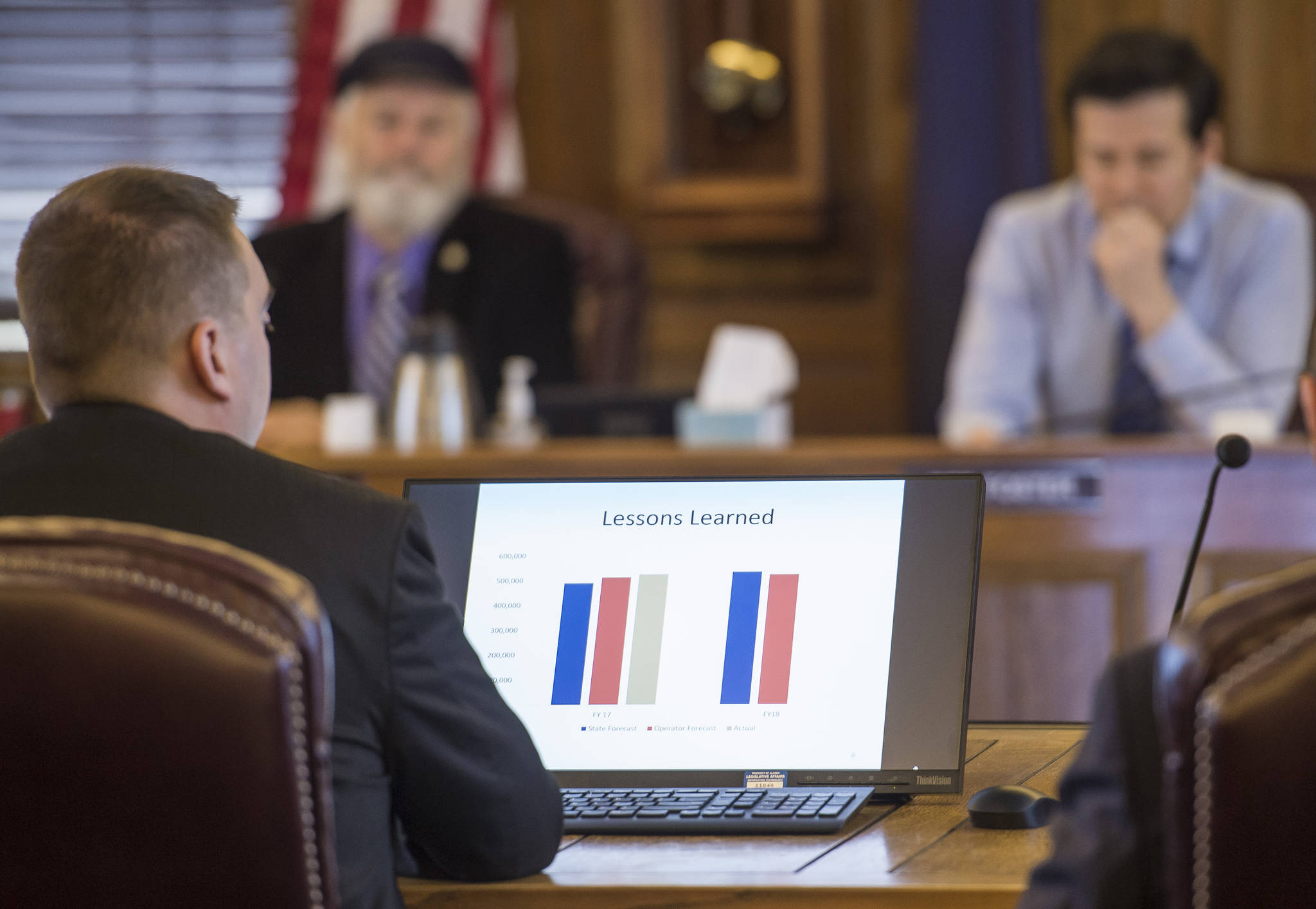 House Finance Committee members listen as Ed King, Legislative Liaison for the Department of Natural Resources, give the Preliminary 2017 Fall Production Forecast at the Capitol on Wednesday, Oct. 25, 2017. (Michael Penn | Juneau Empire)