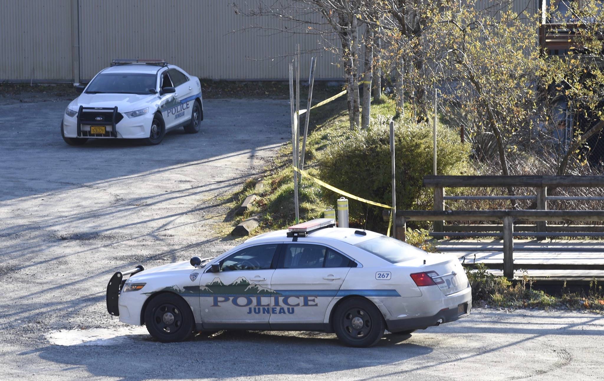 Juneau police guard a body found along the waterfront south of the Juneau Public Library on Thursday, Nov. 9, 2017. (Michael Penn | Juneau Empire)