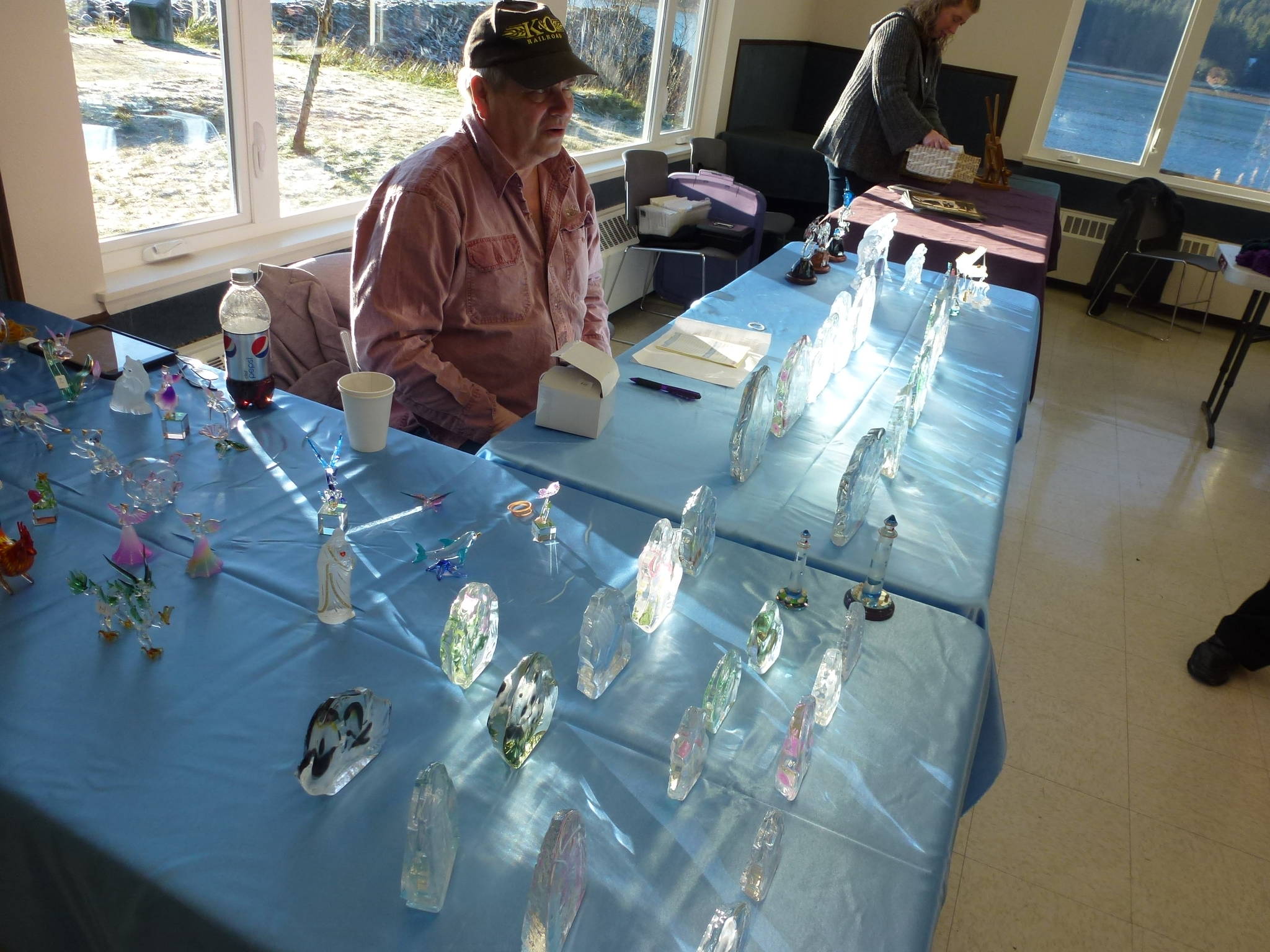 Robert Gibson, a glass blower from Skagway, shows off his wares at the 2013 Sons of Norway, Svalbard Lodge Holiday Bazaar in Juneau. This year’s bazaar is taking place this Saturday. (Photo courtesy of Elfrida Nord)