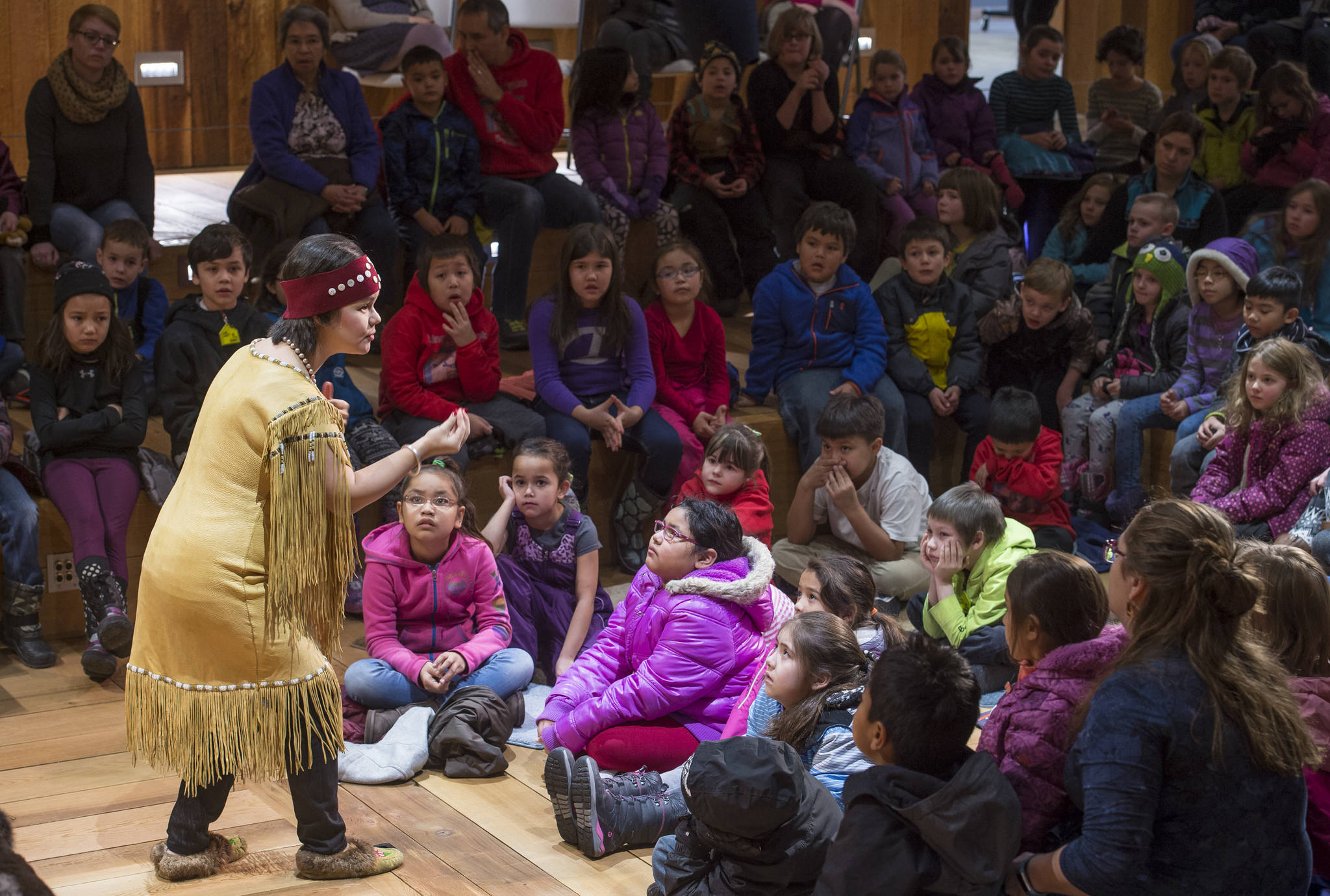 Lily Hope tells a story about respecting nature to second-grade students from Harborview Elementary and Juneau Charter Community Schools at the Walter Soboleff Center on Thursday, Nov. 16, 2017. The Storytelling Excursion for all Juneau School District second graders is part of the Any Given Child programming sponsored by the Juneau School District, Mayor’s office, University of Alaska Southeast, Sealaska Heritage Institute and the Juneau Arts and Humanities Council. (Michael Penn | Juneau Empire)