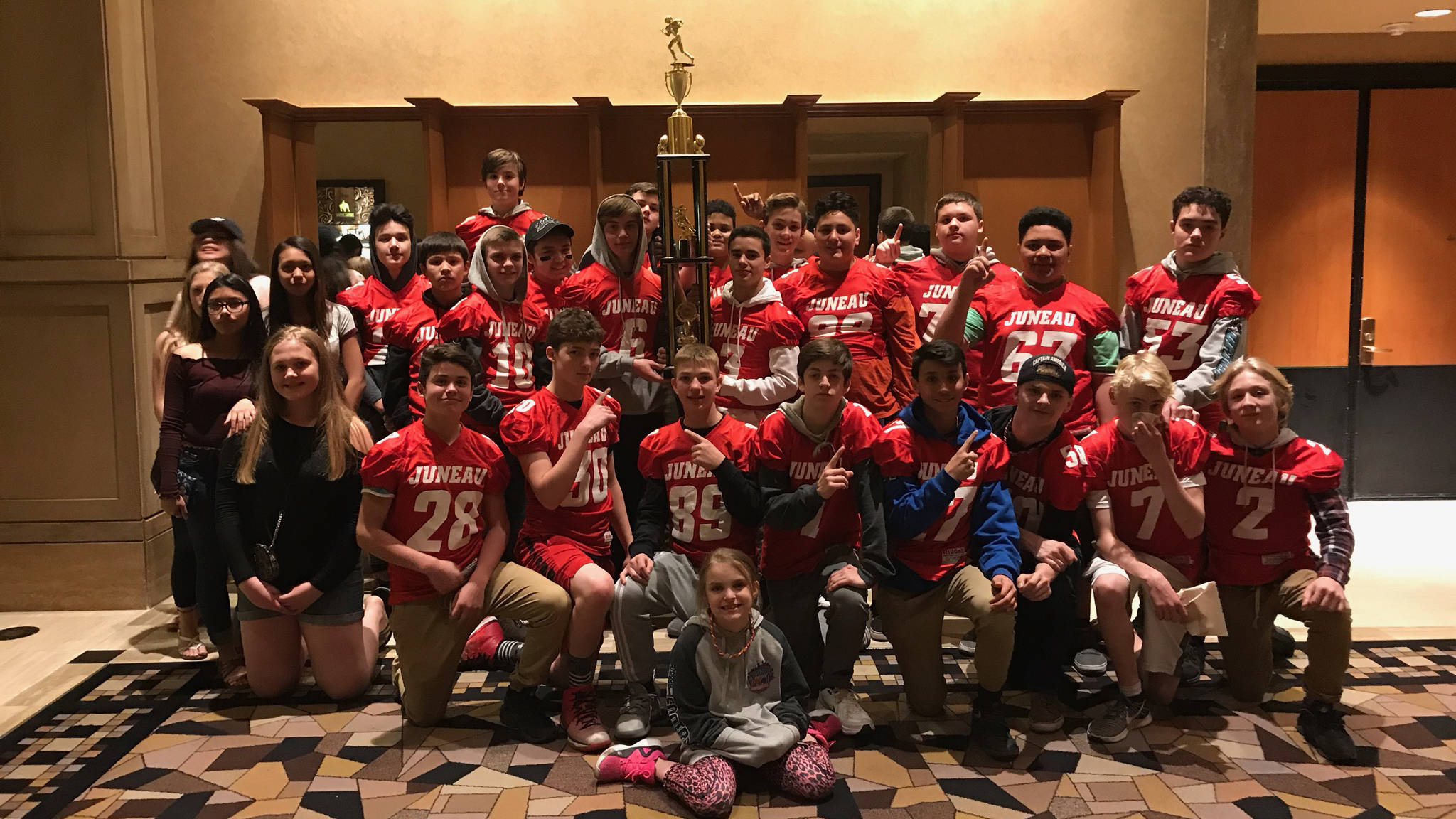 The Juneau Youth Football League 49ers celebrate their 13U Central championship at the National Youth Football Championships in Las Vegas on Saturday, Nov. 25, 2017. (Photo courtesy of Chris Connally)