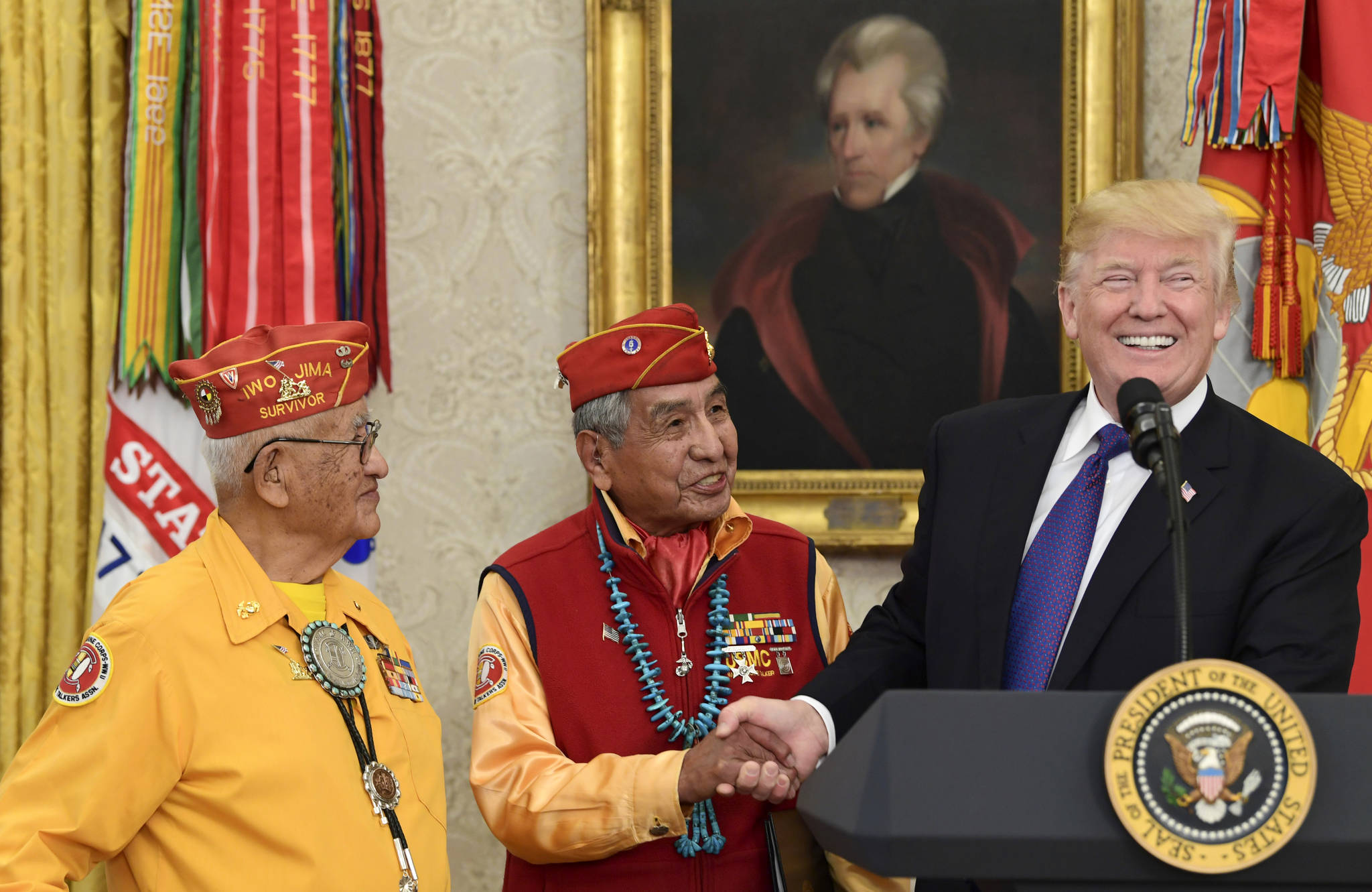 President Donald Trump, right, meets with Navajo Code Talkers Peter MacDonald, center, and Thomas Begay, left, in the Oval Office of the White House in Washington, Monday, Nov. 27, 2017. (Susan Walsh | The Associated Press)