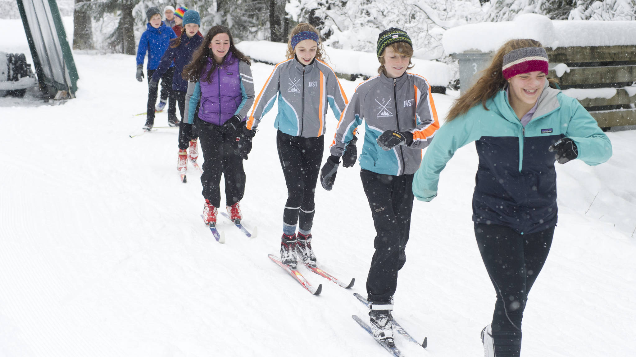 Juneau Nordic Ski Team members Erin Wallace, front, leads Aaron Blust and Anna Iverson in a pole-less skiing drill through fresh snow on Saturday, Nov. 18, 2017, at the Mendenhall Campgrounds. The JNST attended a Thanksgiving clinic in Anchorage Nov. 24-26 with teams from Nome and Unalakleet and led by two-time Olympian Lars Flora. (Nolin Ainsworth | Juneau Empire)
