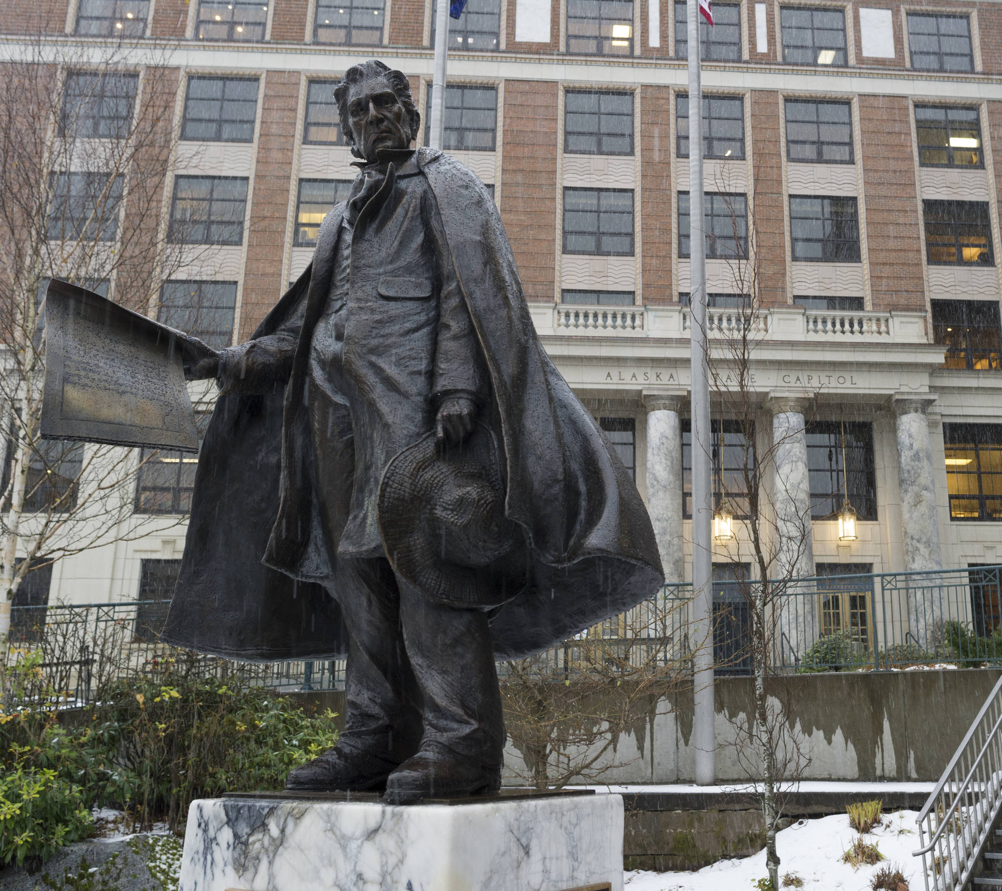 The bronze statue of William Seward is seen in front of the Alaska State Capitol on Friday, Nov. 10, 2017. (James Brooks | Juneau Empire file)