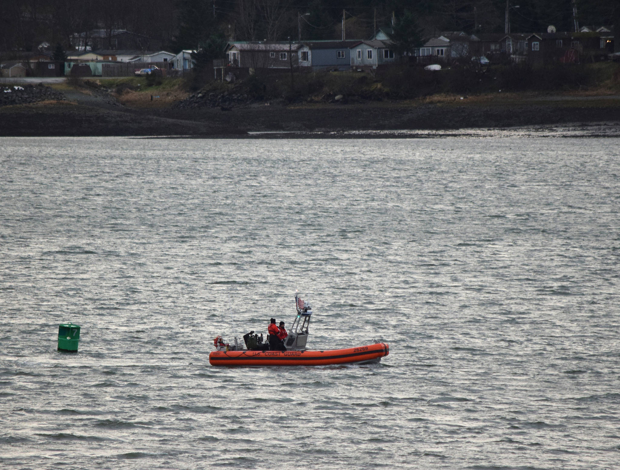 A Coast Guard boat searches Gastineau Channel for two missing boaters on Wednesday, Dec. 6, 2017. (Angelo Saggiomo | Juneau Empire)