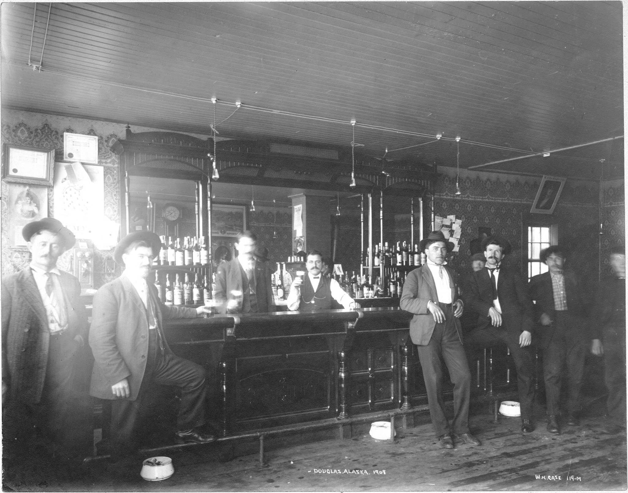 This photo served as the cover to the first edition of Douglas Vandegraft’s “A Guide to the Notorious Bars of Alaska.” “Bar in Douglas, AK, 1908” P39-0802 Copyright Alaska State Library Case & Draper Photograph Collection
