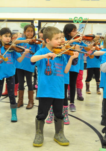Students in the Juneau Alaska Music Matters program perform at Glacier Valley Elementary School. (Photo courtesy of the Juneau Community Foundation)
