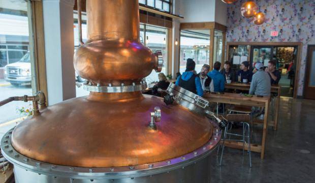 A large still is the centerpiece in the tasting room at the Amalga Distillery at Franklin and Second Streets in downtown Juneau on Sept. 14, 2017. (Michael Penn | Juneau Empire File)