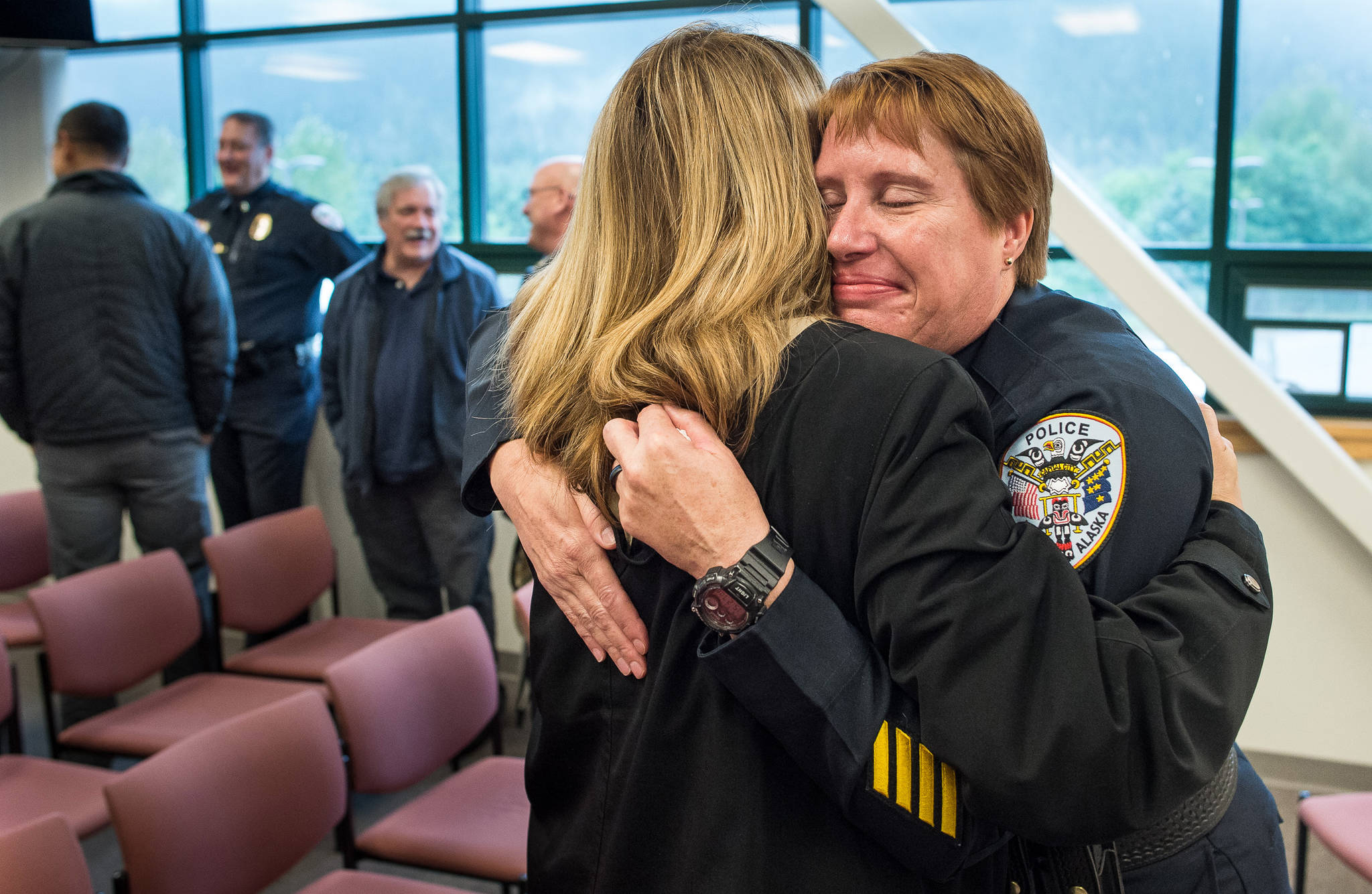 In this Aug. 31 photo, Lt. Kris Sell receives at her retirement party at the Juneau Police Department. (Michael Penn | Juneau Empire File)
