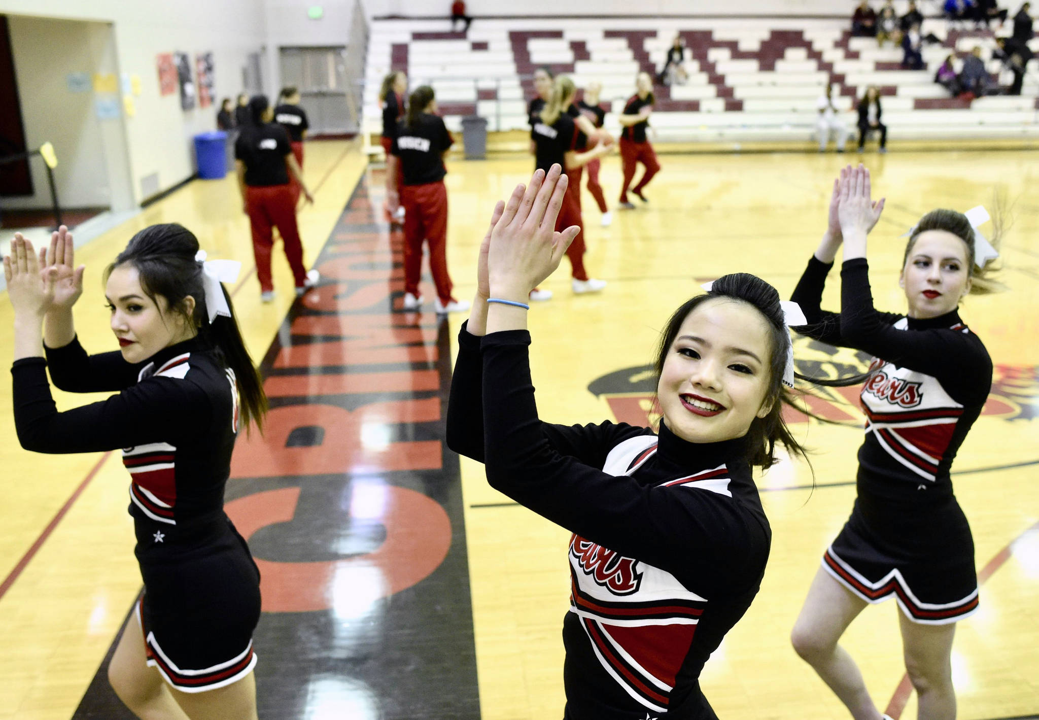 Juneau-Douglas High School cheerleaders and girls basketball team warm up for their opening game at the Capital City Classic at JDHS on Wednesday, Dec. 27, 2017. (Michael Penn | Juneau Empire)  Juneau-Douglas High School cheerleaders and girls basketball team warm up for their opening game at the Capital City Classic at JDHS on Wednesday, Dec. 27, 2017.
