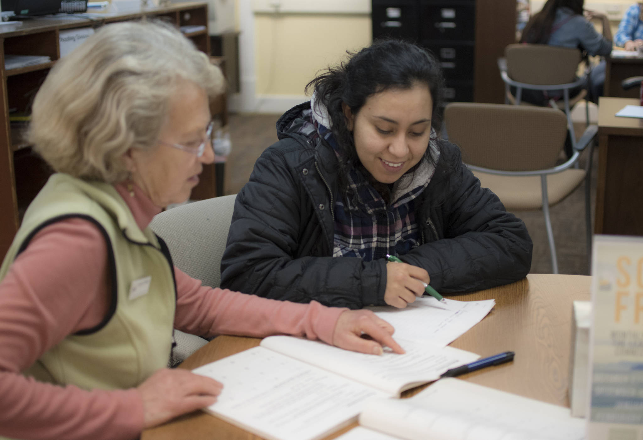 Courtesy Photo | SERRC  Alma Espinoza, right, receives one-on-one math tutoring from The Learning Connection educator Joyanne Bloom in December 2017, at the 210 Ferry Way location. TLC offers free classes and tutoring for adults.