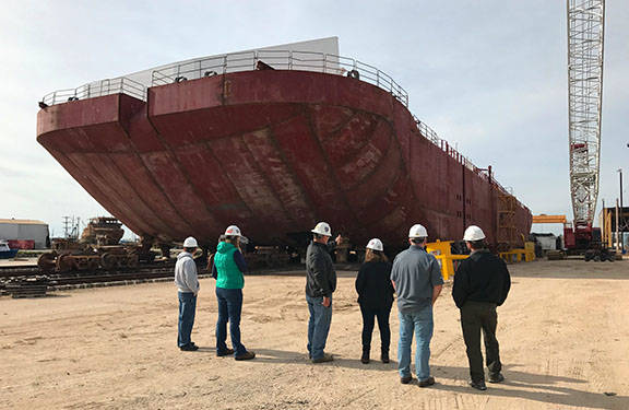 Alyeska personnel and Prince William Sound community members visit OSRB-4, a large purpose-built open water response barge under construction in Amelia, La. (Contributed photo)