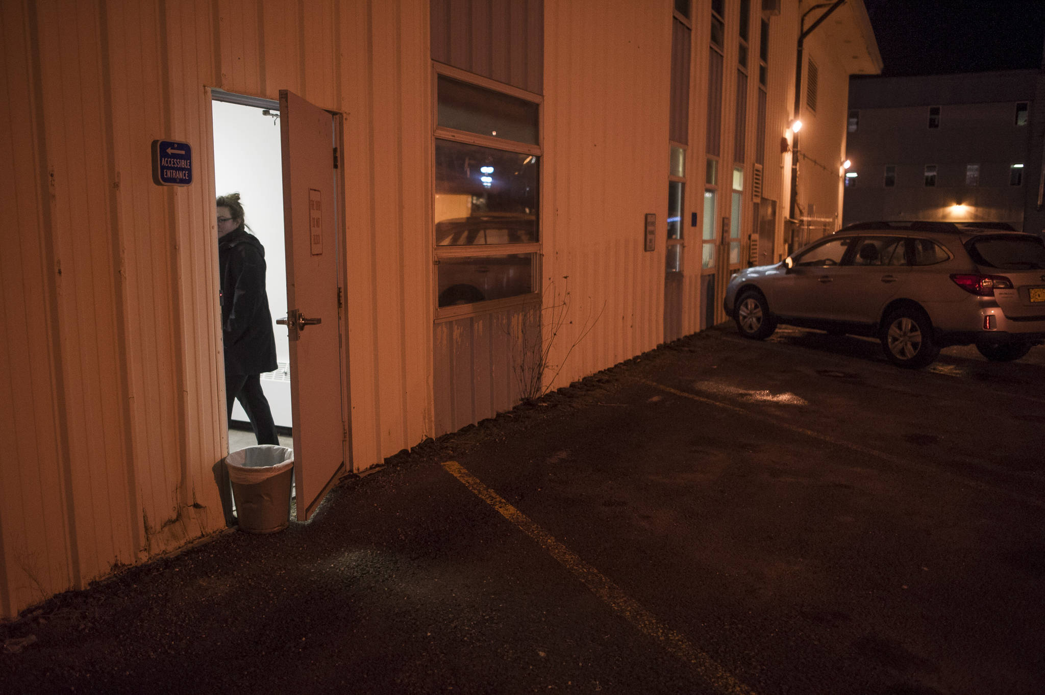 Mandy Cole, chairwoman of the Juneau Coalition on Housing and Homelessness, waits for homeless people at a new warming shelter in the old Public Safety Building on Whittier Street on Friday, Dec. 1, 2017. (Michael Penn | Juneau Empire)