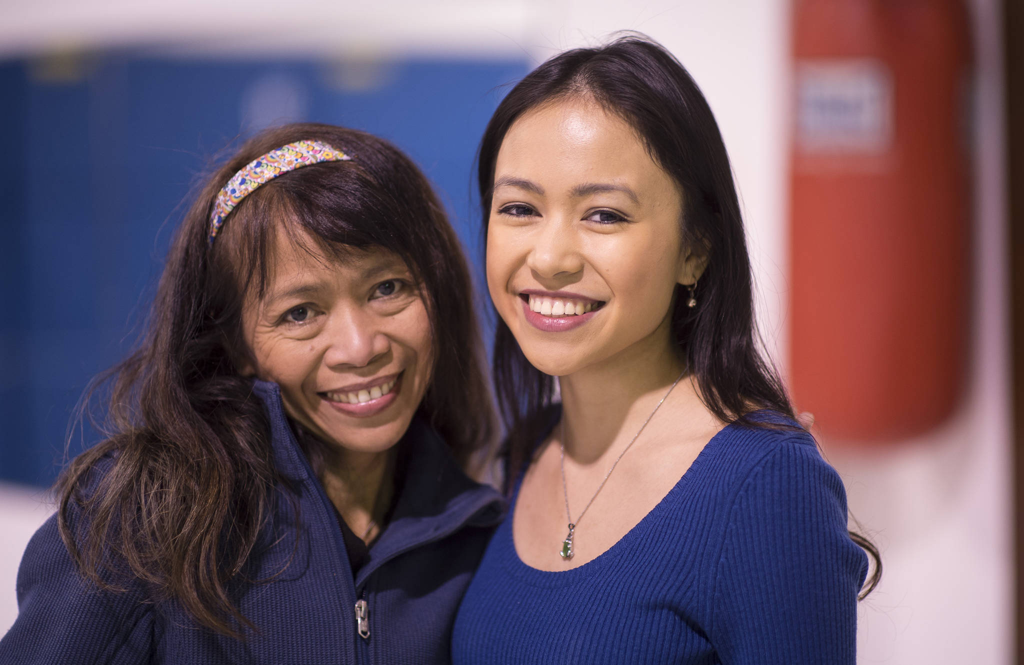 Marella Gungob, right, poses with her mother, Miriam Wagoner, during an interview at the Juneau Shotokan dojo on Thursday, Jan. 11, 2018. Gungob will participate in Kakehashi Project under the sponsorships of the Consulate of Japan in Anchorage. This Project is to foster a greater understanding of Japanese politics, society, history and foreign policy via personal exchange by inviting promising future leaders from North America to Japan. (Michael Penn | Juneau Empire)