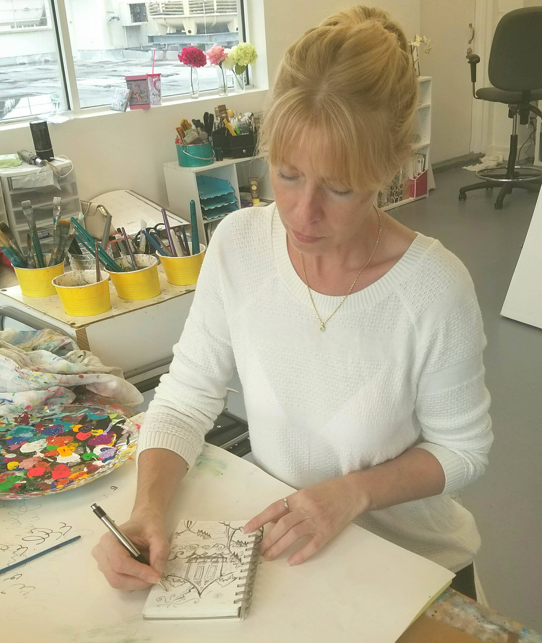 Megan A. Duncanson works on sketches for a new Alaska-themed coloring book in her Miami studio. Photo by Tara Neilson