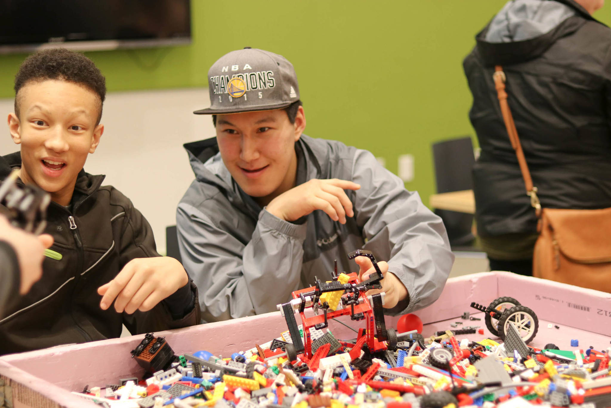 Joshua Walker, 14, and Byron Dock, 17, enthusiastically take part in the LEGO building challenge Saturday afternoon. Photos by Erin Laughlin | For the Capital City Weekly