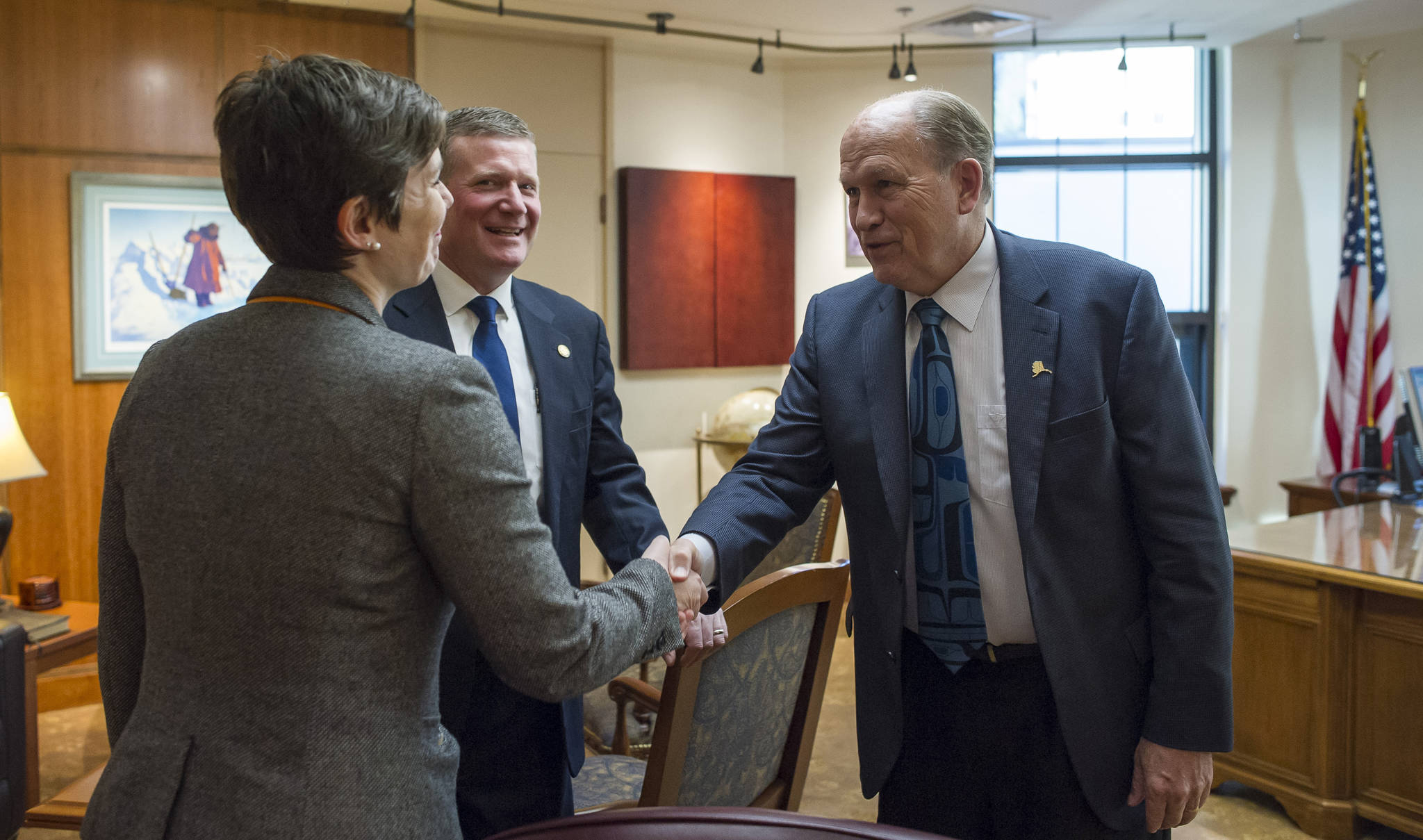 Rep. Ivy Spohnholz, D-Anchorage, left, and Rep. Chuck Kopp, R-Anchorage, deliver a message to Gov. Bill Walker that the House is open for business on Tuesday, Jan. 16, 2018. Legislators returned to Alaska’s Capitol to open the Second Session of the 30th Legislature on Tuesday. (Michael Penn | Juneau Empire)