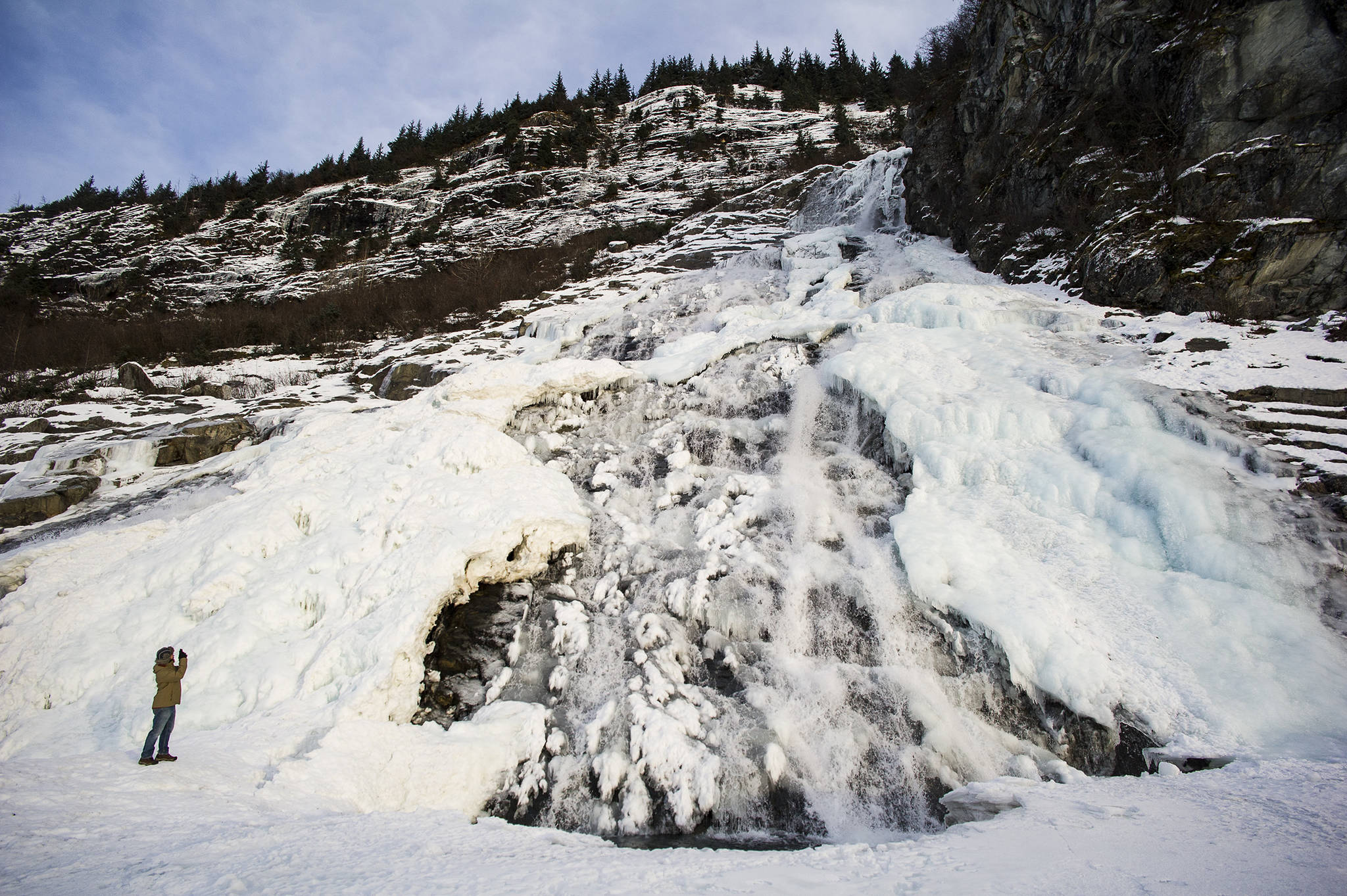 In this Dec. 2016 photo, a partially-frozen Nugget Falls at Mendenhall Lake. (Michael Penn | Juneau Empire File)