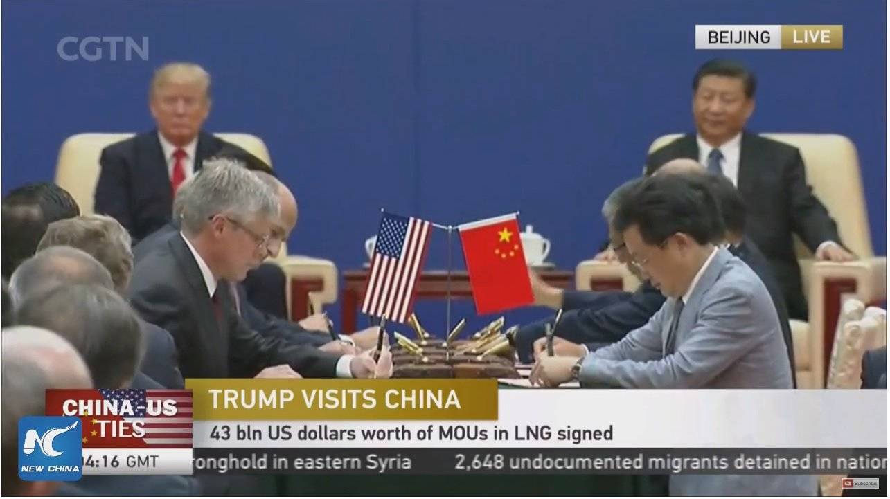 In this screengrab from Chinese state TV on Nov. 9, 2017, Alaska Gov. Bill Walker and others in Beijing sign a $43 billion development agreement for a trans-Alaska natural gas pipeline.