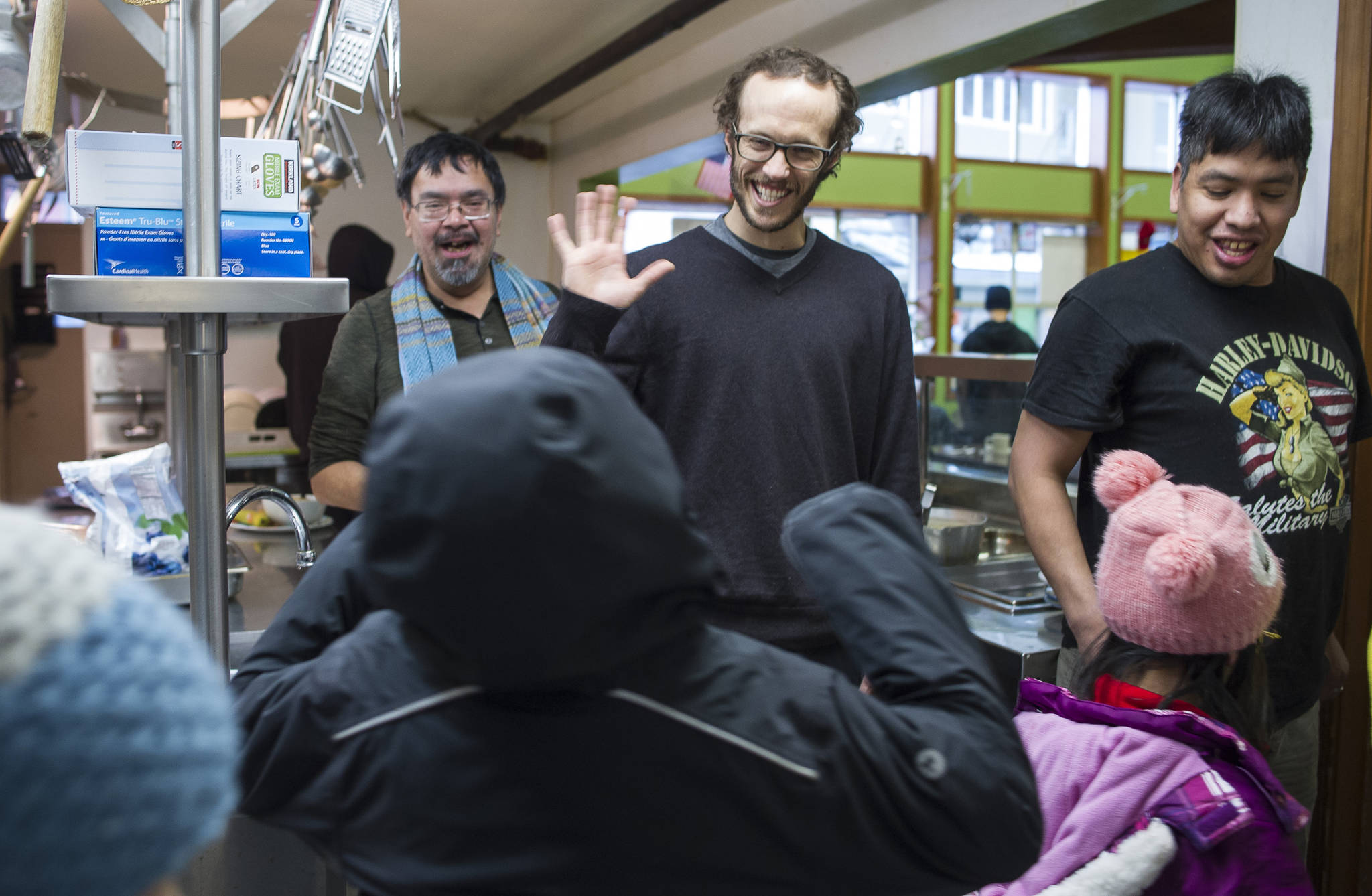 Interim Director of the Glory Hole Kyle Hargrave, center, thanks second grade students from Harborview Elementary School after their donation of fresh vegetables on Friday, Jan. 26, 2018. (Michael Penn | Juneau Empire)