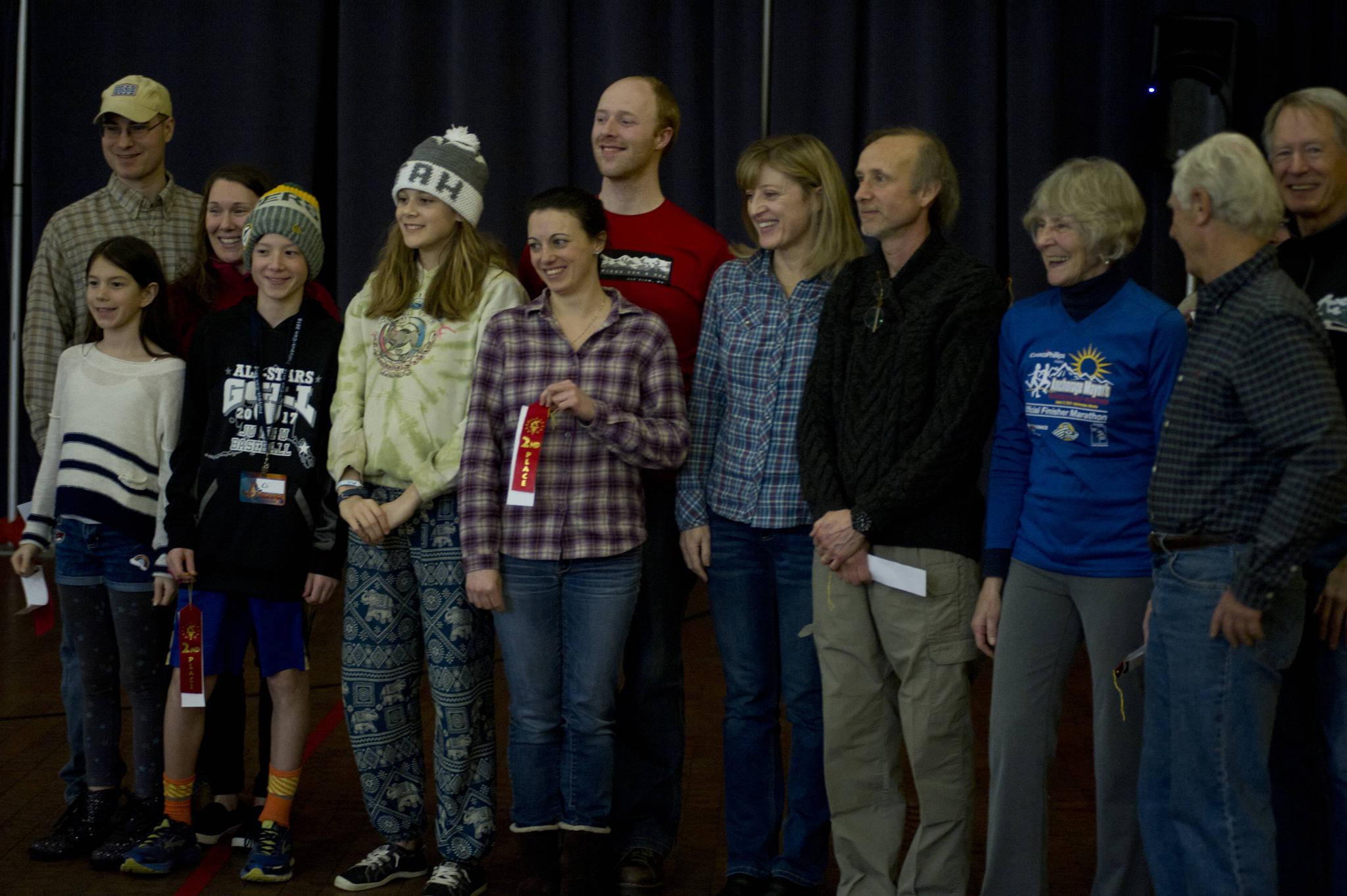 The second-place finishers in the Nugget Alaskan Outfitter Cup Series pose for a picture at the Juneau Trail and Road Runners potluck and awards ceremony Saturday, Jan. 27, at the Juneau Arts and Culture Center. (Nolin Ainsworth | Juneau Empire)