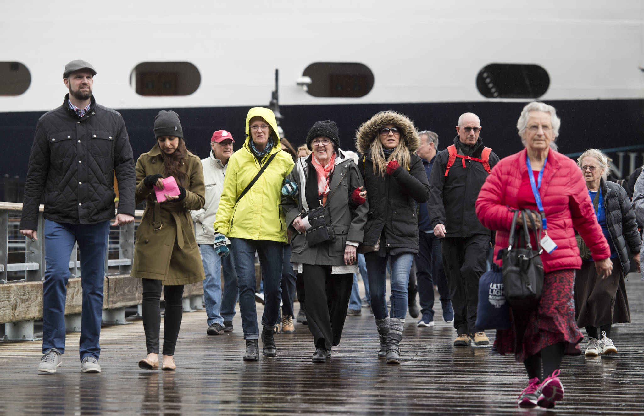 In this May 1, 2017 photo, passengers walk off Holland Amerca Line’s Nieuw Amsterdam. (Michael Penn | Juneau Empire File)