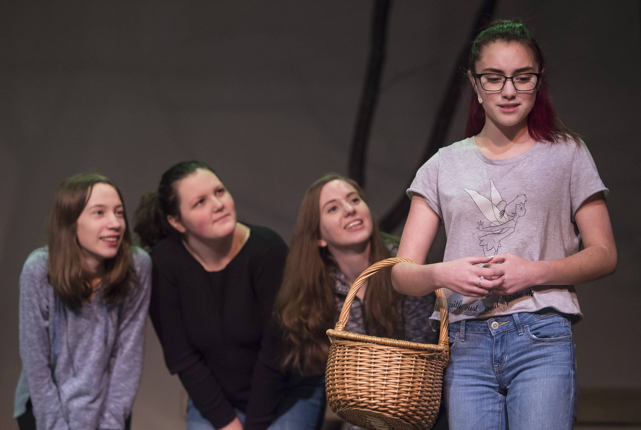 Clara Smith, as Little Red Riding Hood, right, meets Kiera Liska, left, Amanda McDowell and Kamy Hamrick, as the Three Little Pigs, during rehearsal of Juneau-Douglas High School’s production of “Into the Woods” at JDHS on Wednesday, Jan. 31, 2018.