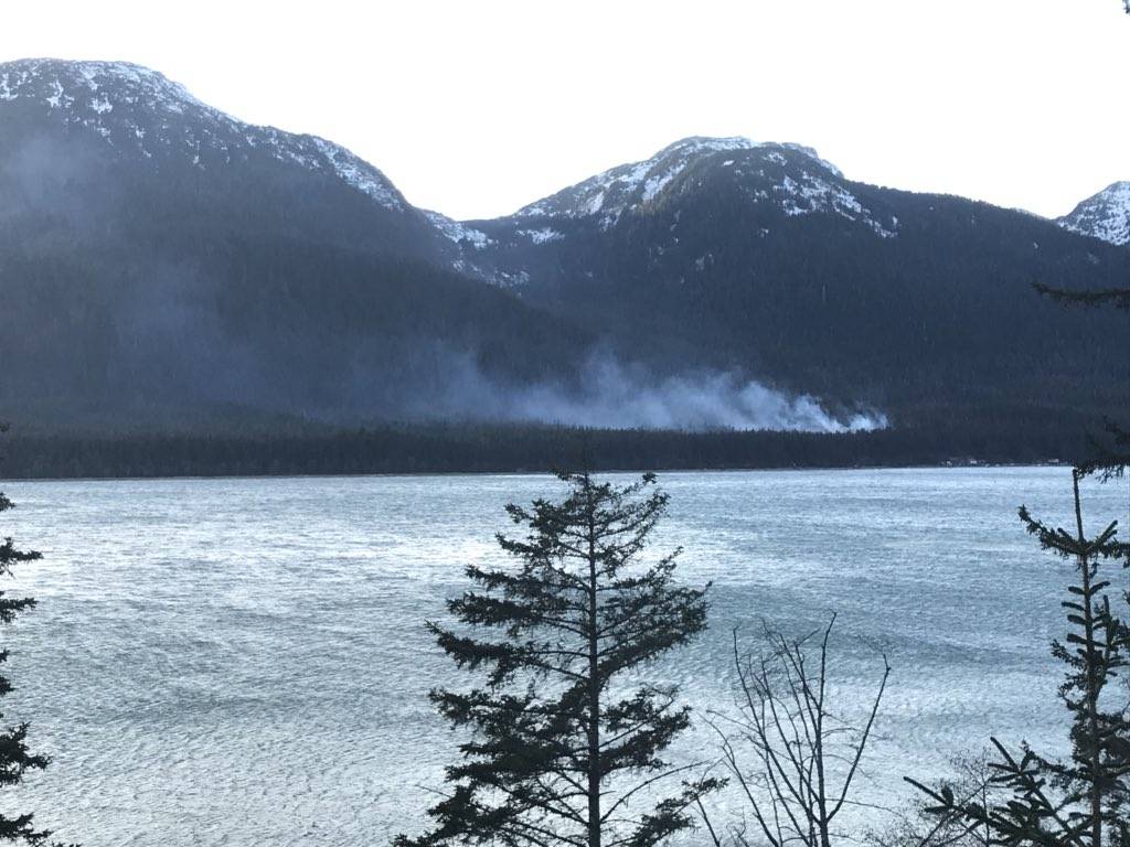Smoke rises from a small fire on Douglas Island on Sunday, Feb. 4, 2018. The U.S. Forest Service extinguished the fire, as homes nearby were not in danger. (Alex McCarthy | Juneau Empire)